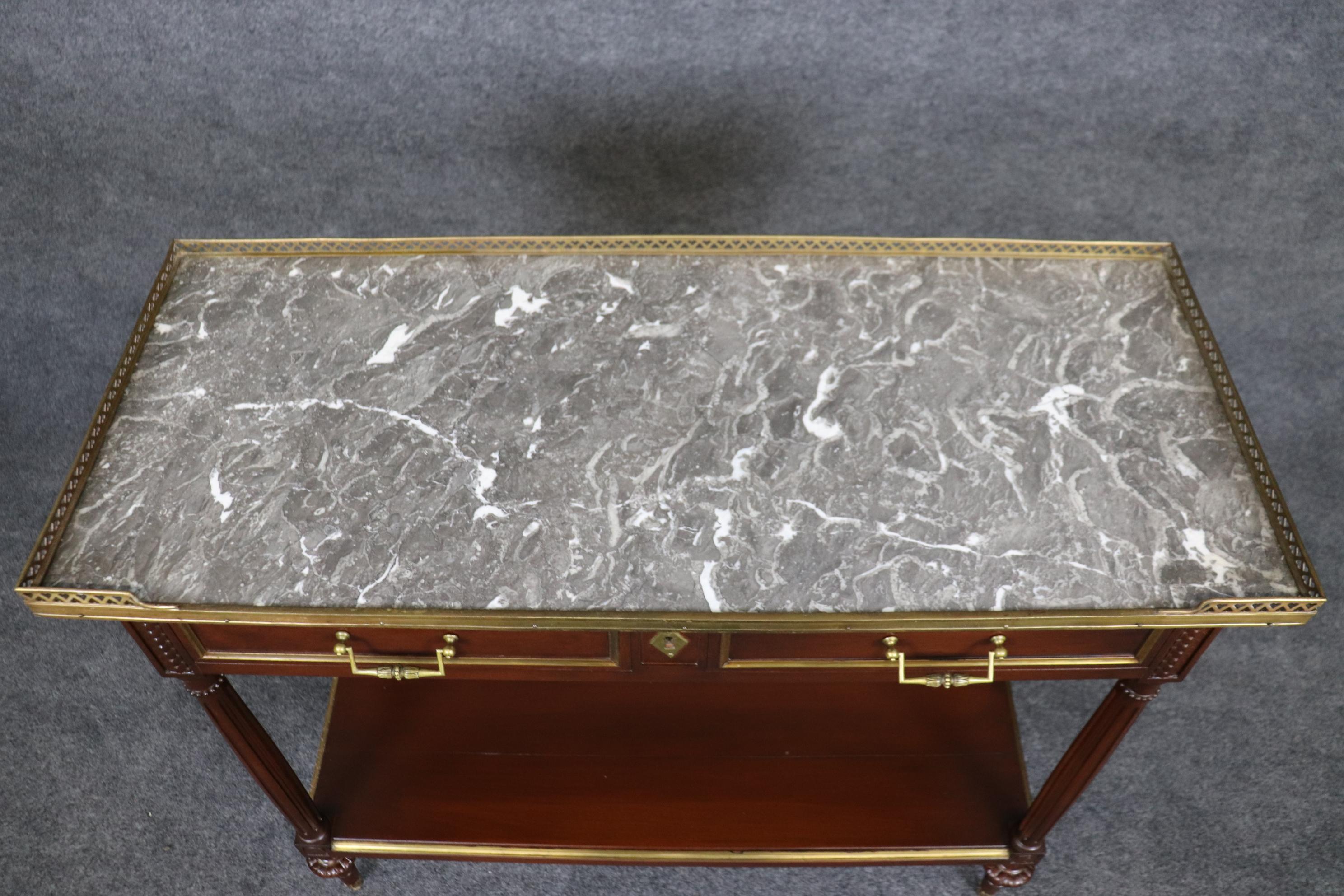 Even though this is not signed we strongly believe this to be Maison Jansen because of the quality of the piece and components of brass and marble. The quality, level of sophistication and overal proportions are beautifully handled and the piece is
