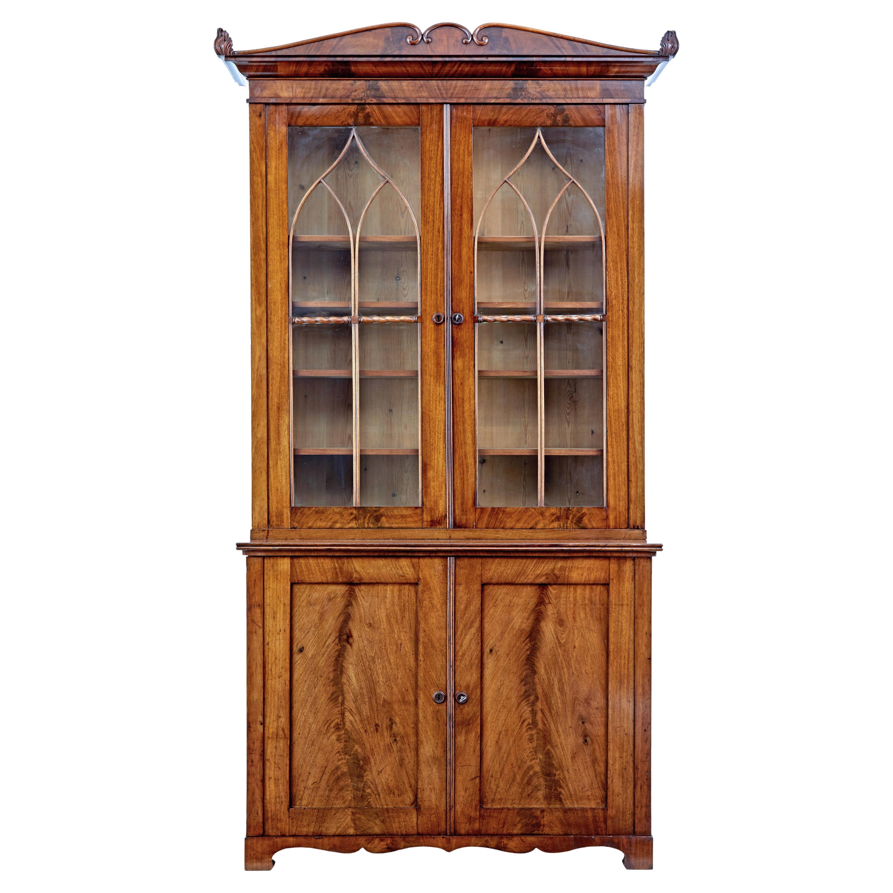 A superb quality early 19th Century mahogany breakfront bookcase For
