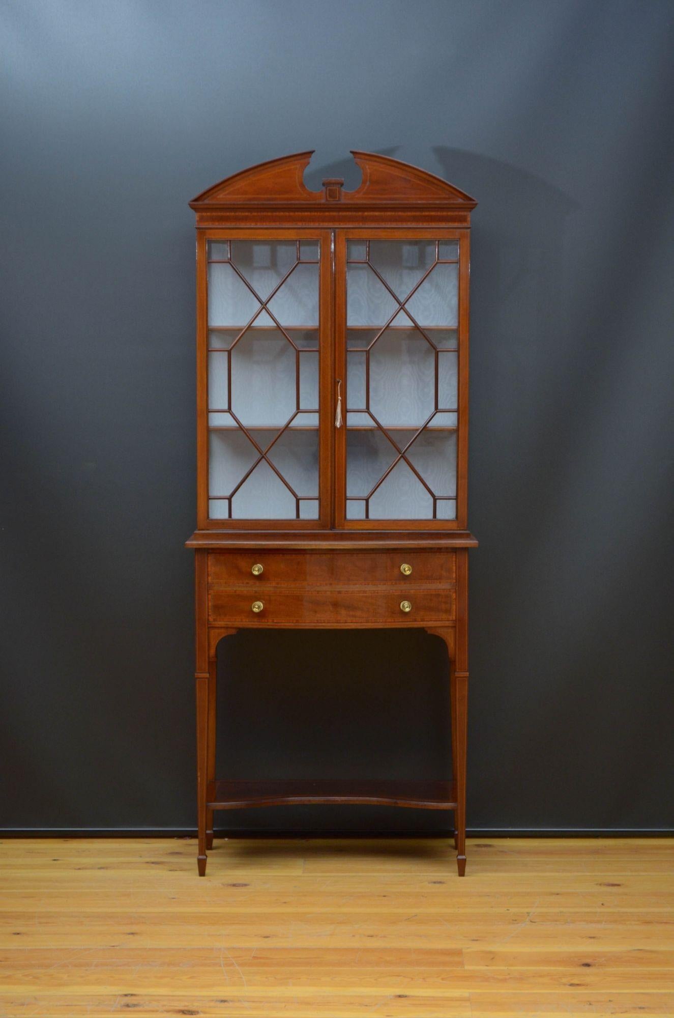 Sn5467 Fine quality Edwardian mahogany and inlaid china cabinet, having swan neck pediment above shallow, satinwood crossbanded frieze and a paid of astragal glazed door fitted with original working lock and a key and enclosing newly relined