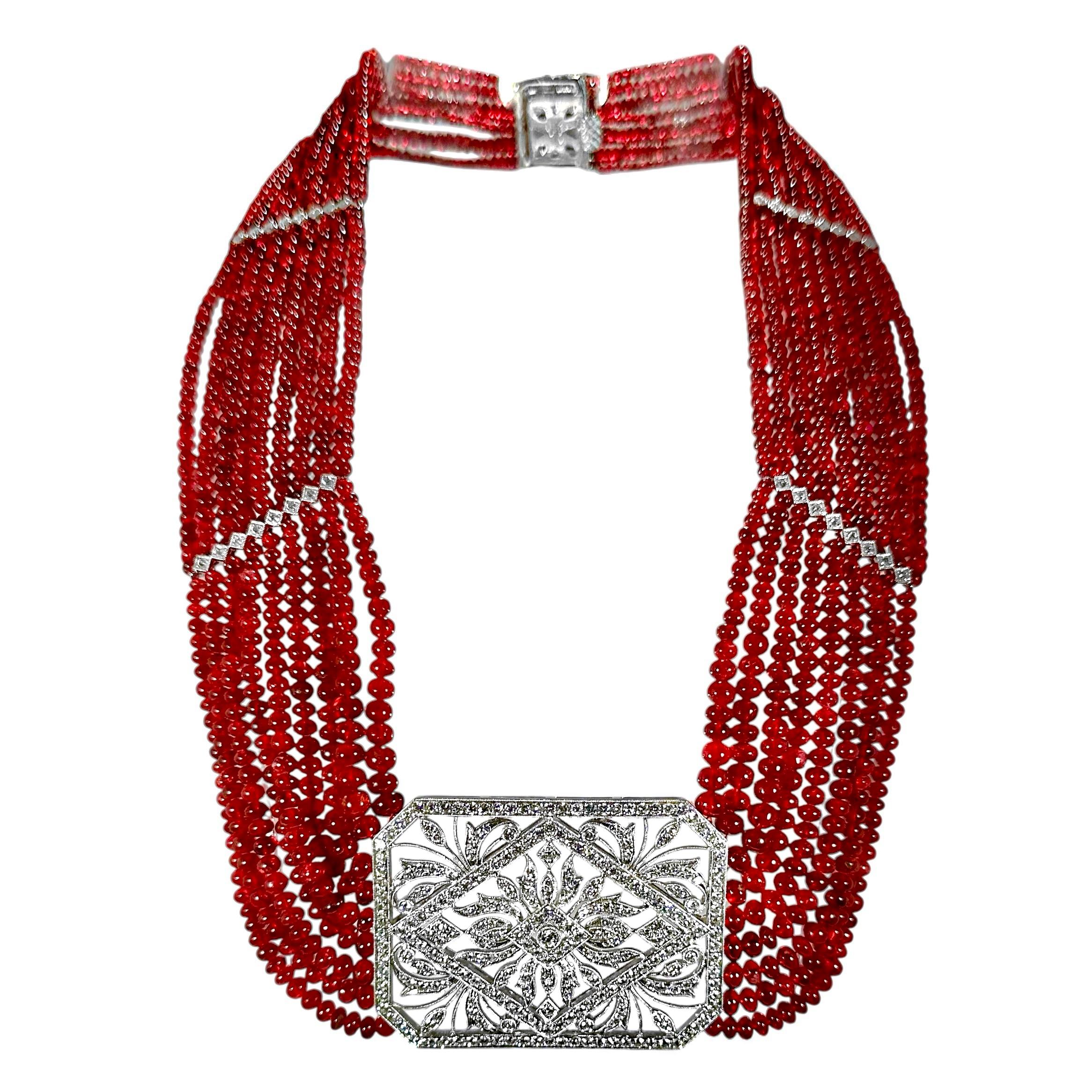This wonderful, expertly crafted, and faithfully designed 18K white gold Edwardian Tribute necklace is visually as powerful as it is beautiful. A large diamond encrusted rectangular center panel measures a full 2 inches by 1 1/2 inches and is