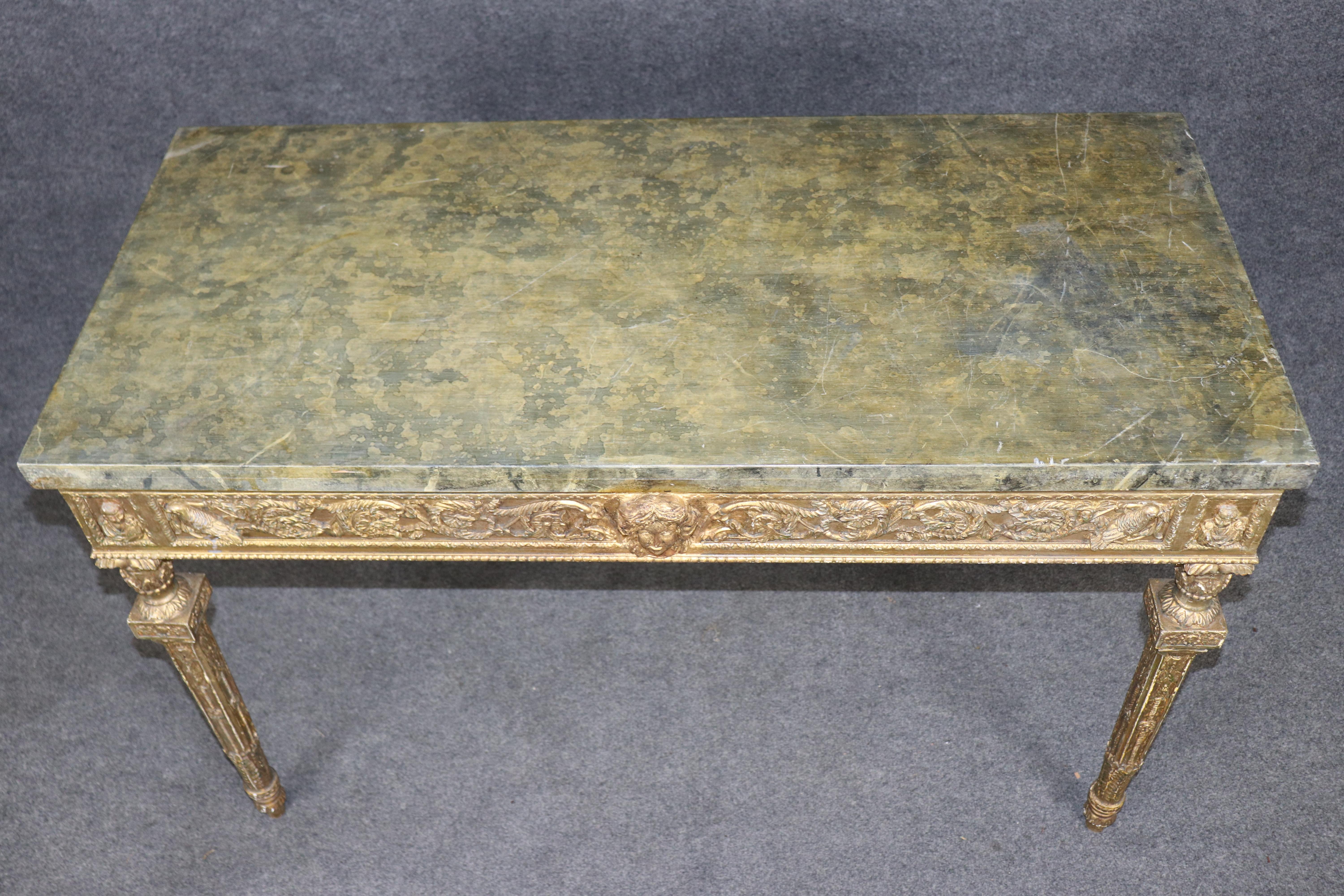 This elegant Theodore Alexander console table exemplifies the company’s hallmark dedication to artisanal craftsmanship, classical detailing, and luxurious decorative finishes. Designed in a refined neoclassical style, the table features an expertly