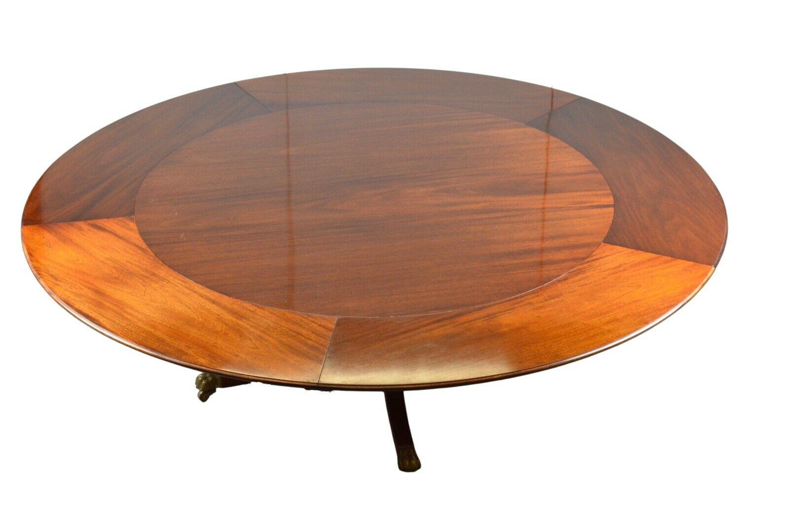We are delighted to offer for sale this collectible table circa 1980 by William Tillman one of the best English furniture makers. This handsome table is very solid and is raised on a quadruple base which is fitted with brass lion paw castor. It is