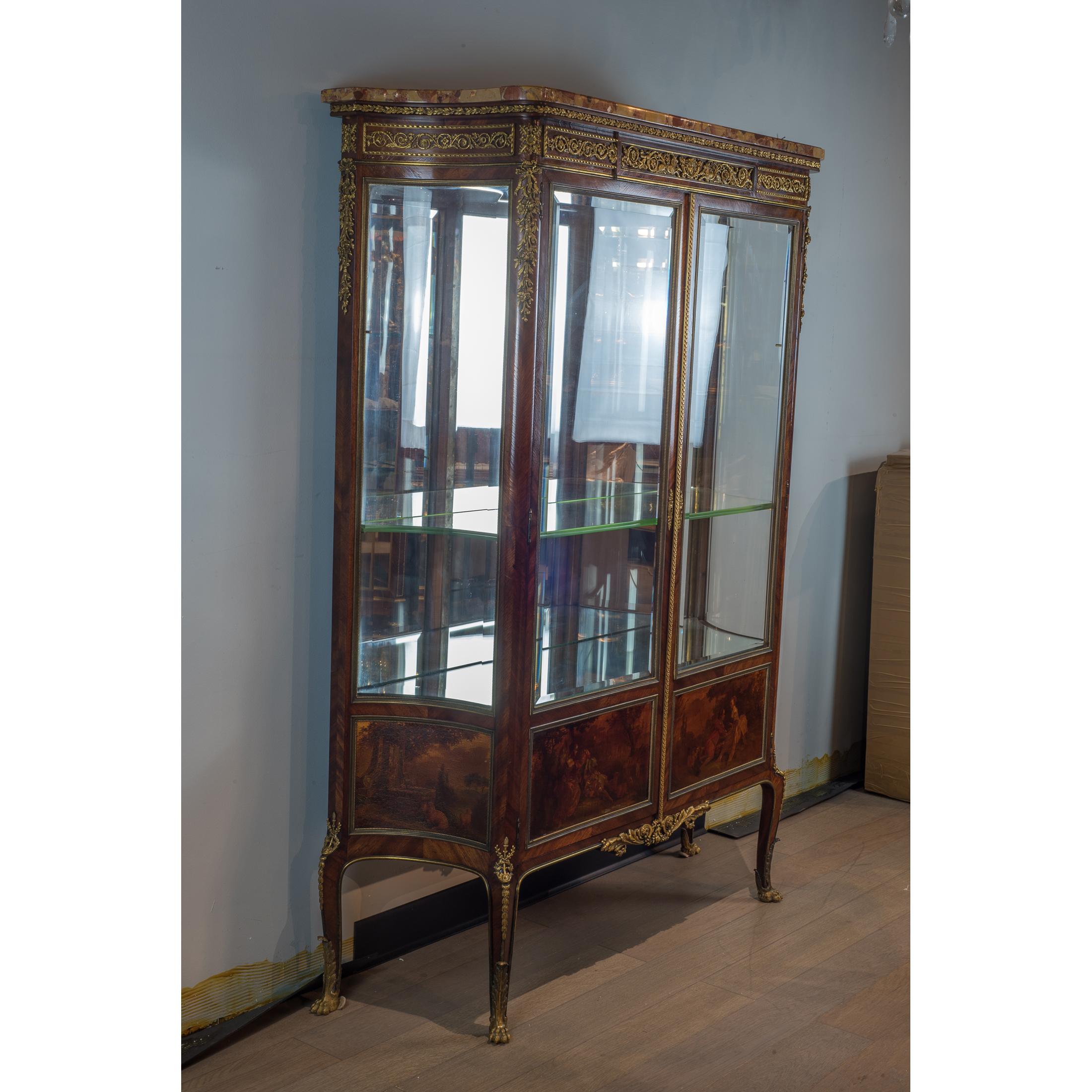 A fine quality French gilt bronze mounted Vitrine with Brèche d'Alep marble top attributed to François Linke. This fine gilt bronze mounted kingwood vitrine is surmounted by a Brèche d'Alep marble top, opening to a mirrored interior fitted with two