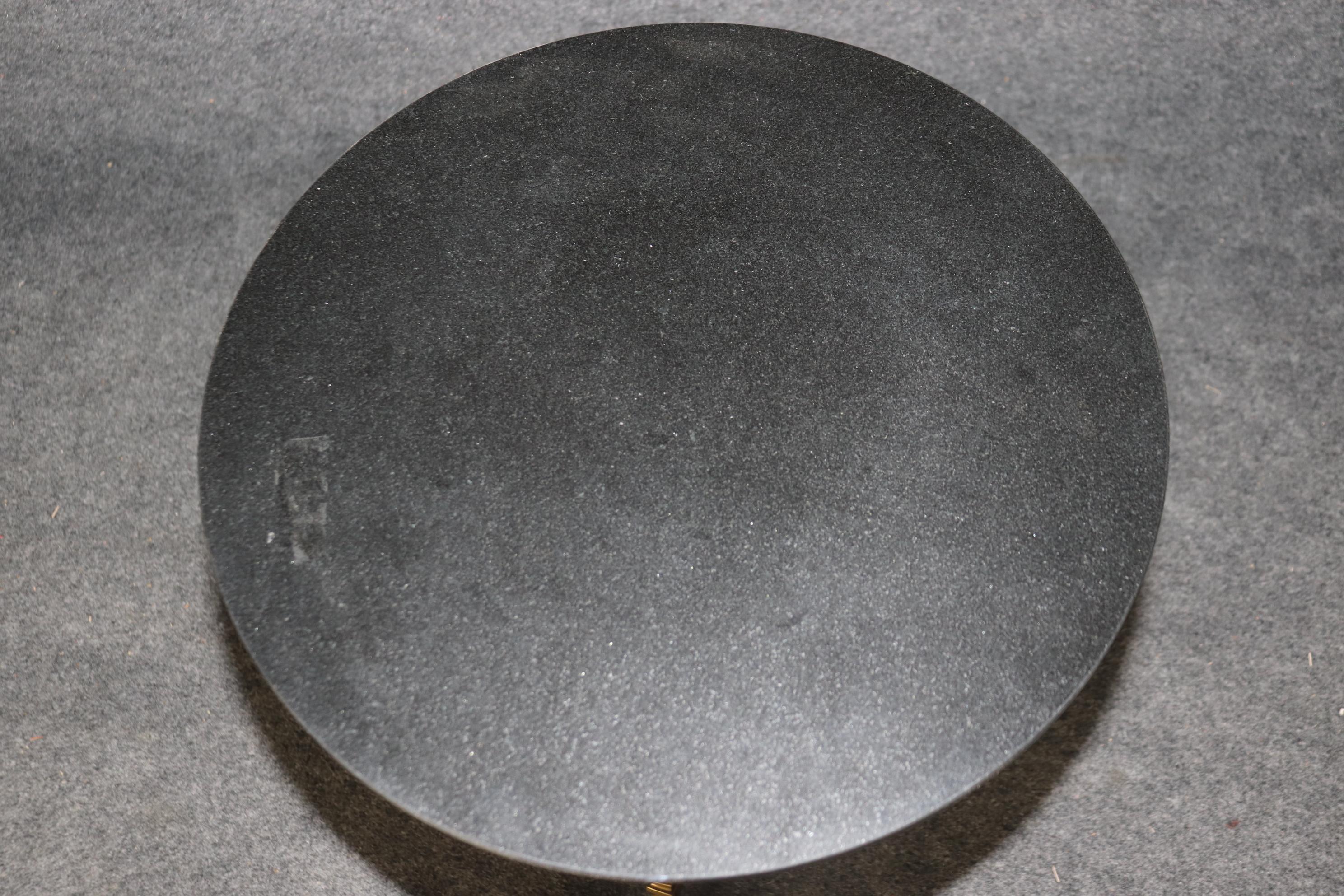 This is a gorgeous end table in the French Regency style, made of marble and bronze. The table is good condition with gorgeous marble and a beautiful Dore' finished bronze paw footed base. Measures 26.75 tall x 18.25 wide x 18.25 deep. Dates to the