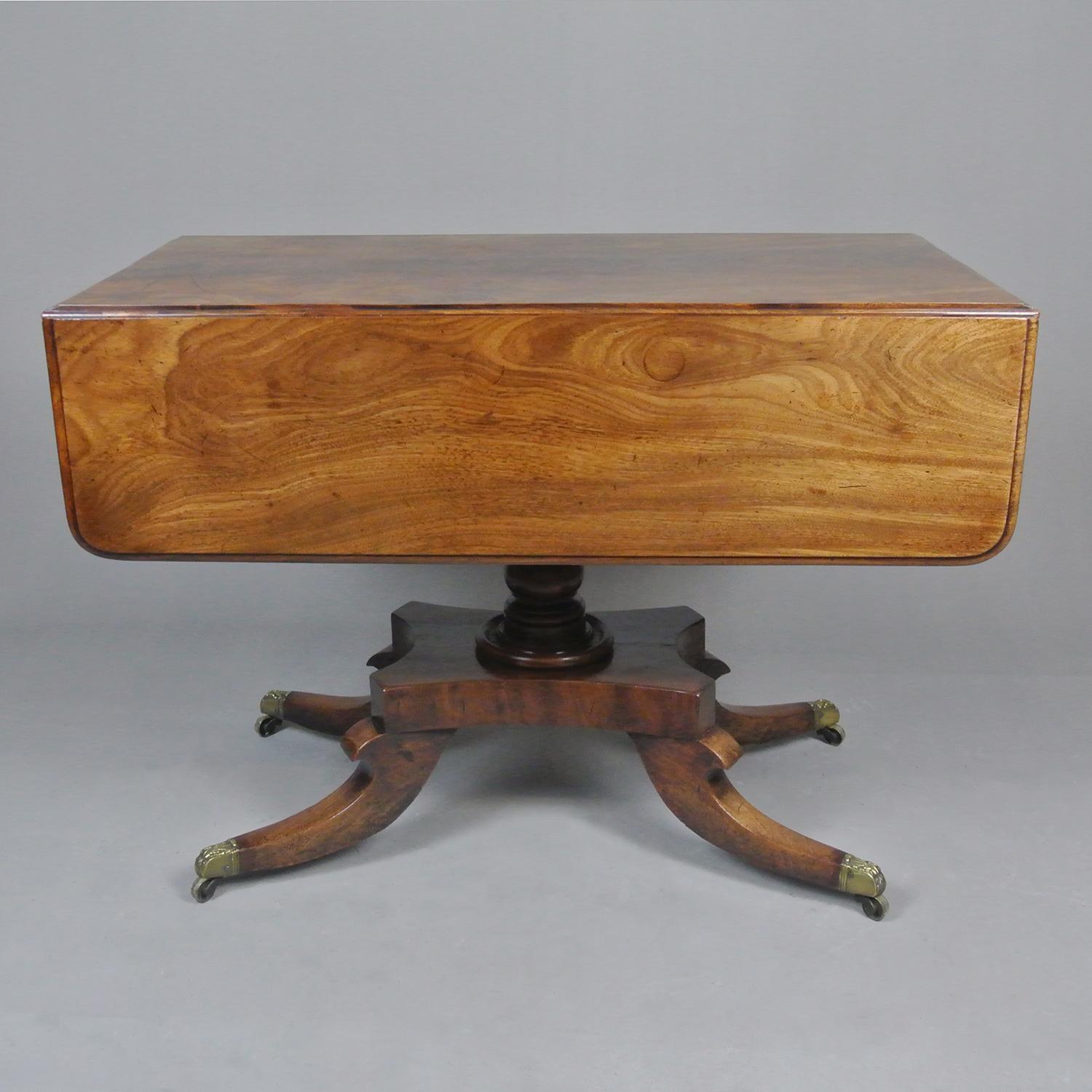 A particularly fine quality mahogany pembroke table. The three part top cut from a single piece of solid Cuban mahogany and beautifully made so that the figuring flows naturally from the leaves and across the bed of the table and the grain is