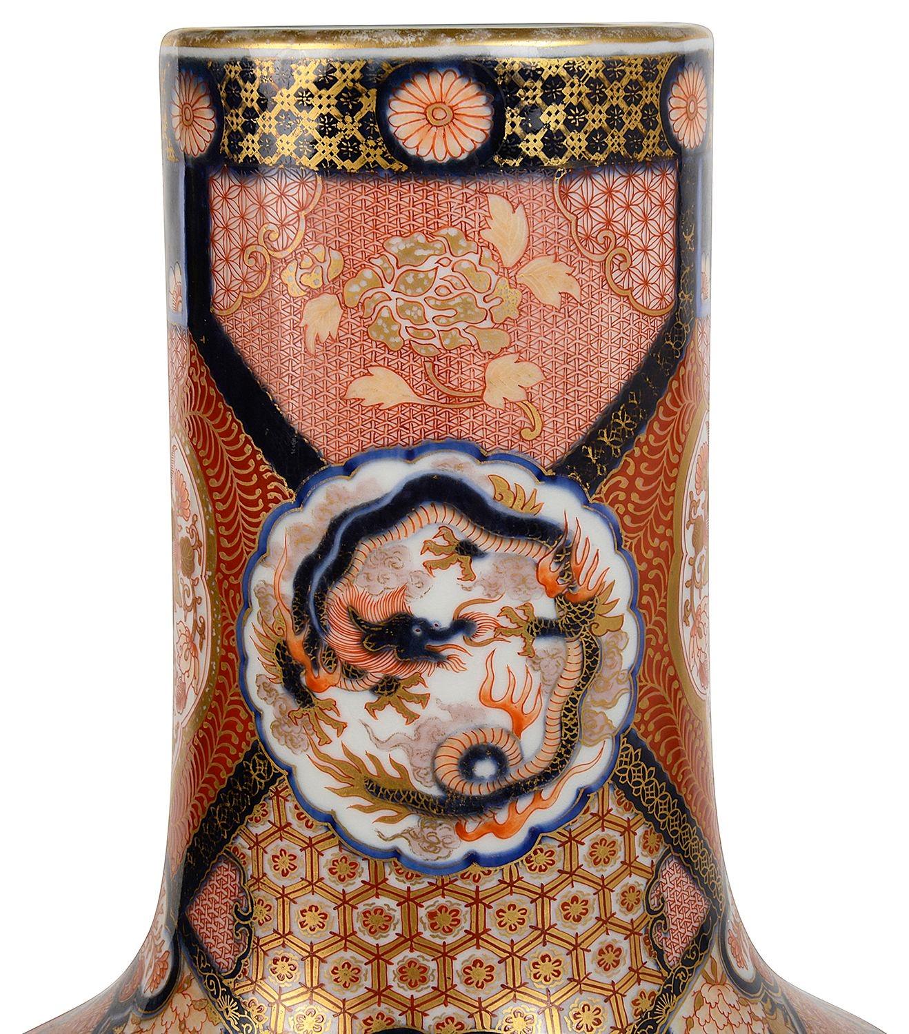 A fine quality late 19th Century Japanese Meiji period (1868-1912) Imari bottle vase. having wonderful bold classical motif decoration with gilded highlights. Beautiful inset hand painted scenes depicting children playing in the gardens.

Batch 81