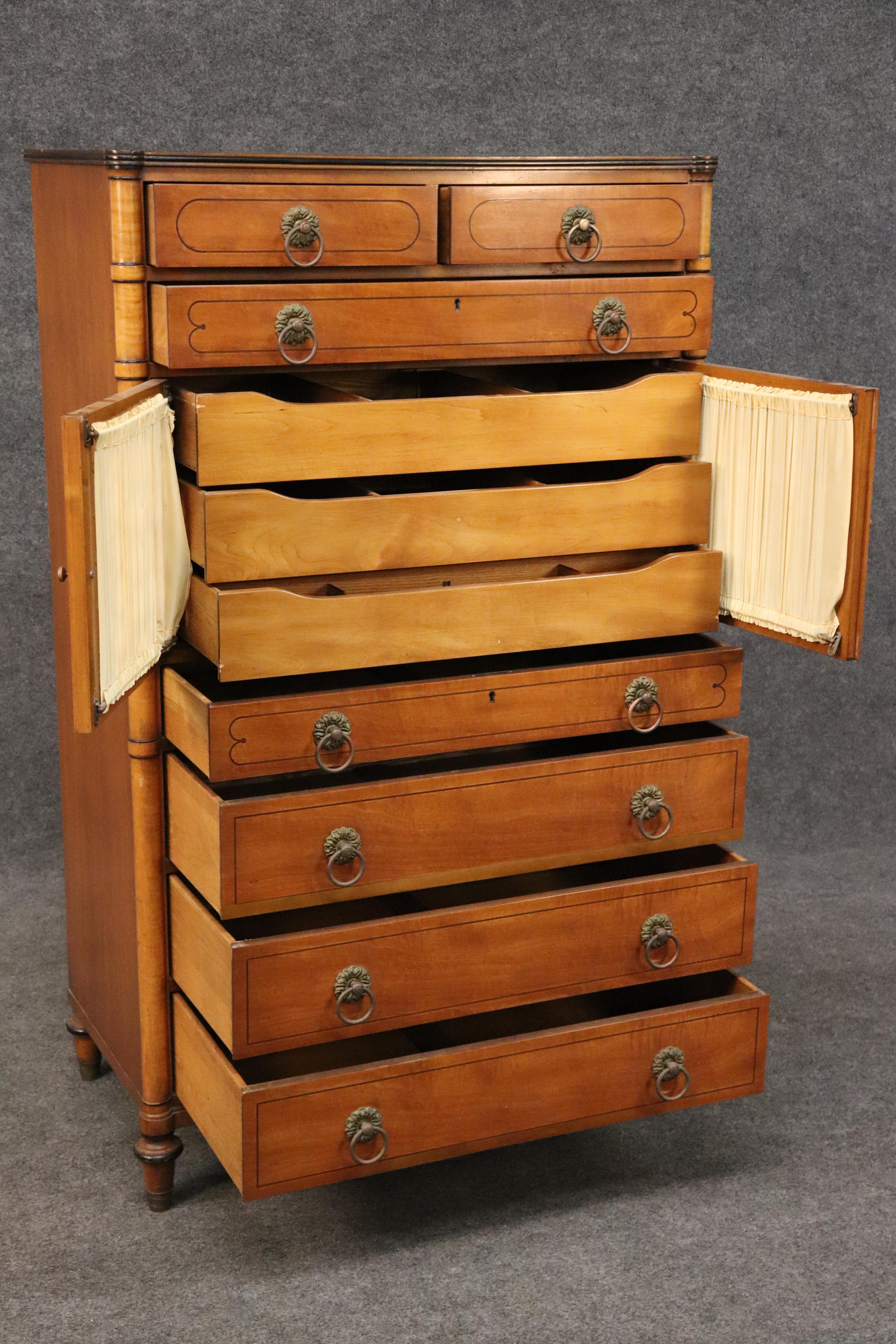 This is a magnificent dresser with the unmistakable English Regency design that is classic and timeless. The dresser is made of solid walnut with satinwood veneer just like the original would have been made in the 1820s era. The dresser is in good