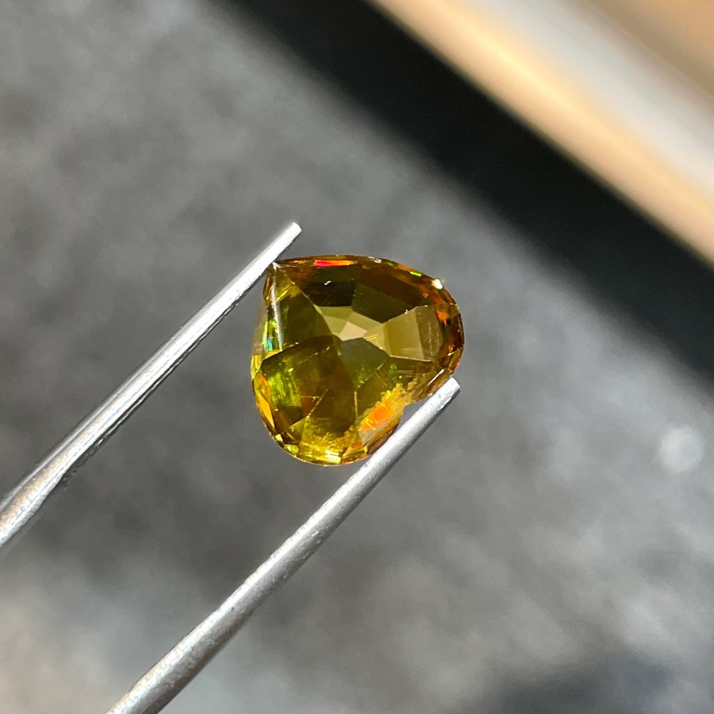 Weight 6.25 carats 
Dimensions 10.5x11.7x7.3 mm
Treatment none 
Origin Madagascar 
Clarity VVS (Very Very Slightly included)
Shape Heart 
Cut Heart




Behold the exquisite allure of a fine quality Sphene Stone, delicately fashioned into a heart