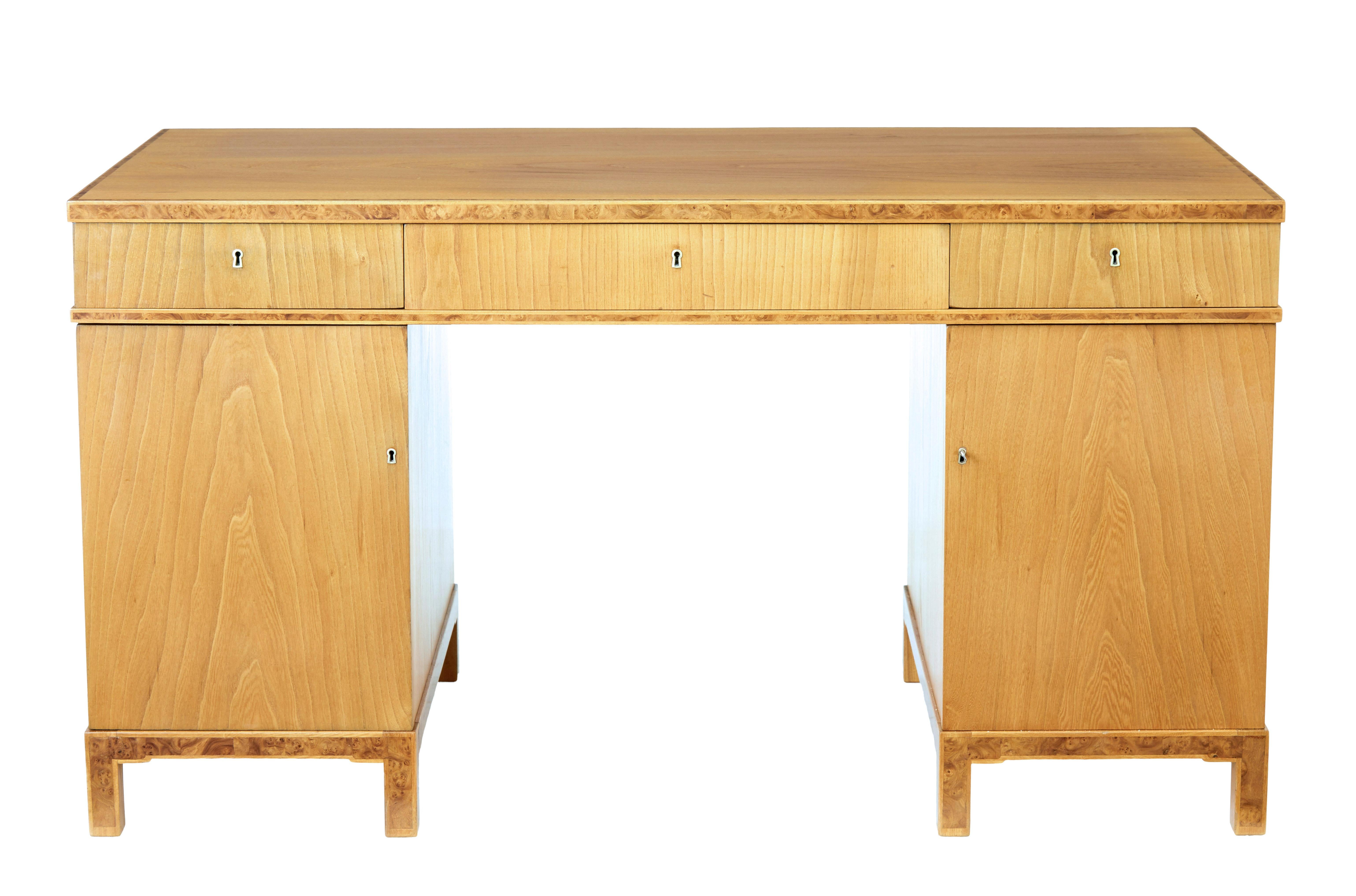 Fine quality mid-20th century Scandinavian elm pedestal desk, circa 1940.

3 part pedestal desk, made from the finest elm veneers.

Writing surface, drawer fronts and legs cross banded with burr detailing. 1 piece veneer to the top surface, with