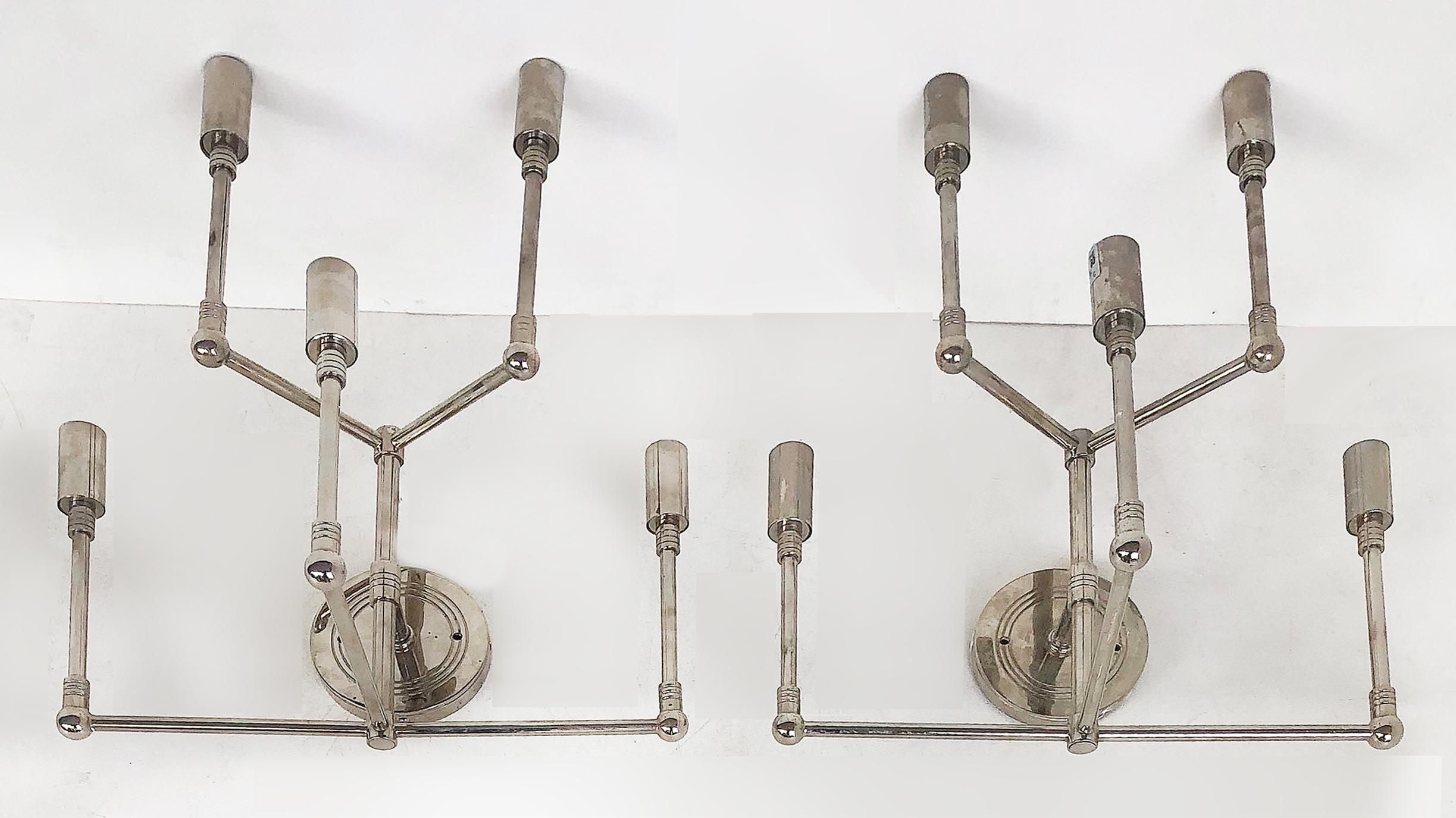 Fine quality mid-century stainless steel wall sconces, pair

Offered for sale is a pair of Mid-Century Modern fine quality stainless steel five-light wall sconces. Each is wired and ready to hang. The Sconces accommodate chandelier bulbs.
     