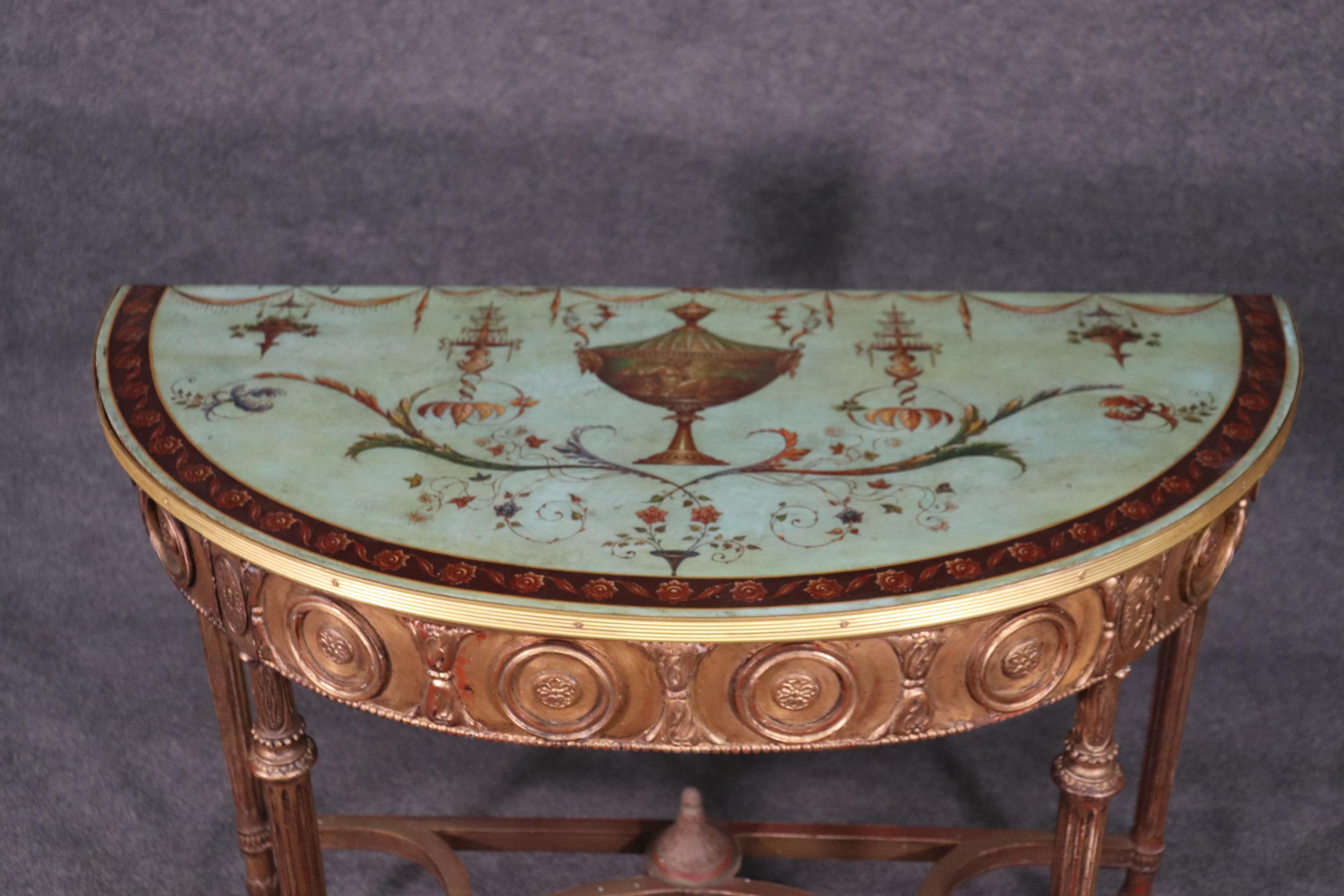 This is a spectacular and extremely unique Adams console table. Look at the finish of the robin's egg blue top and the gorgeous gilded carved front. The table measures 40 wide x 19 deep x 35 tall. The table dates to teh 1880s-90s era.