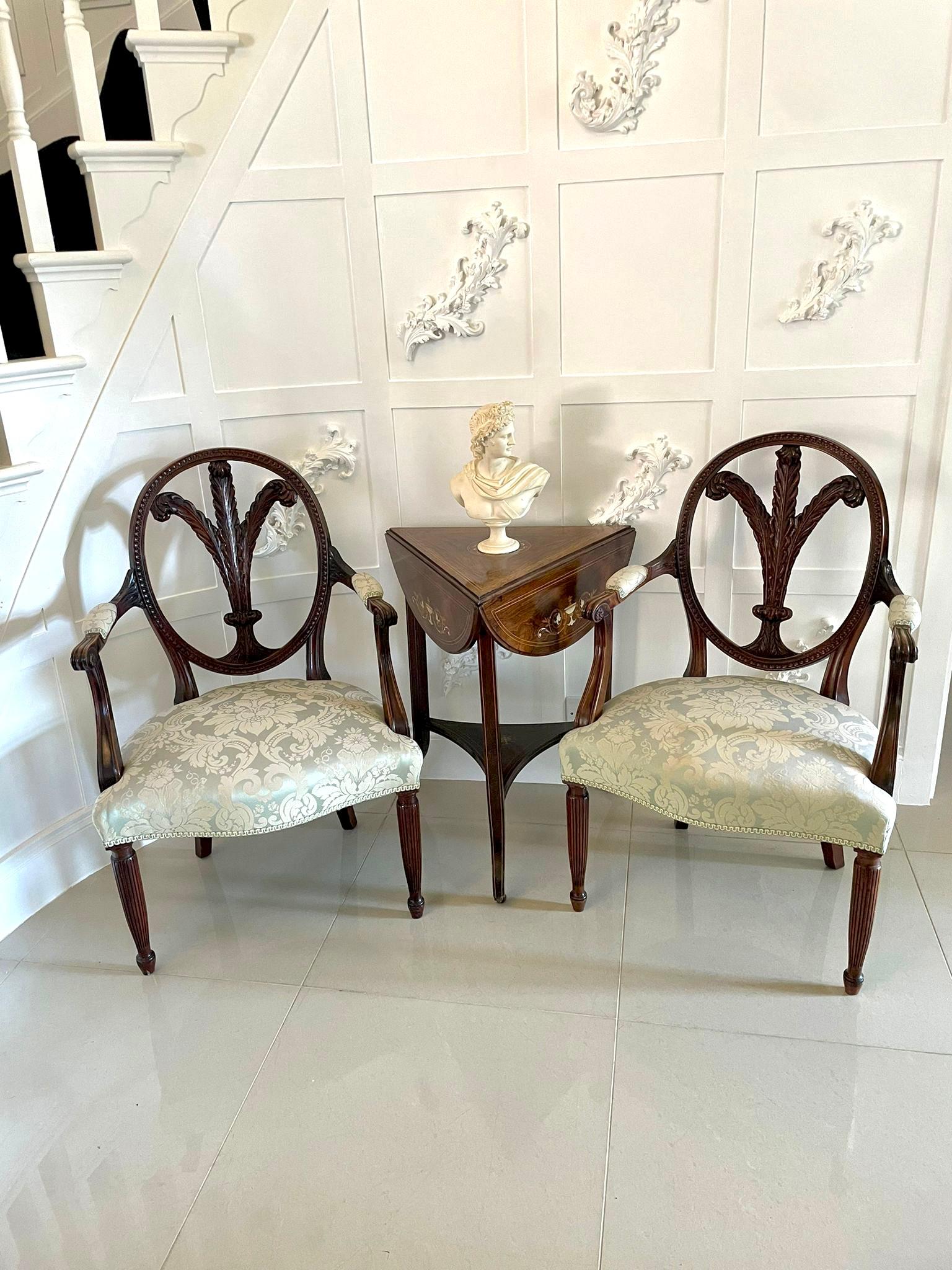 Fine quality pair of antique carved mahogany armchairs having a quality oval carved mahogany shaped back with fantastic carved mahogany Prince of Wales feathers to the centre, shaped open arms, serpentine shaped seat and standing on elegant turned