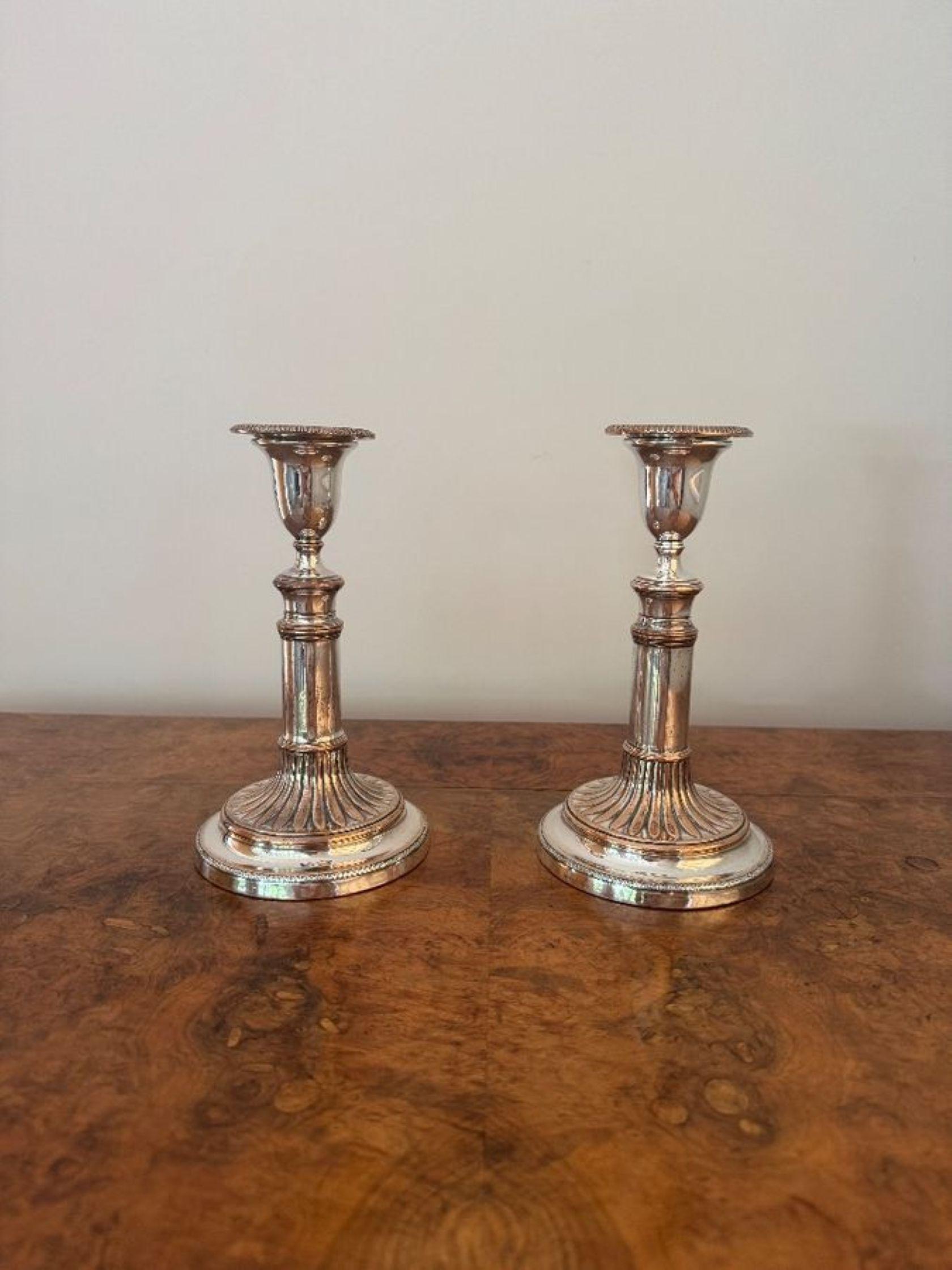 Fine quality pair of antique regency telescopic candlesticks, having a quality pair of antique regency silver plate on copper telescopic candlesticks, having a round stepped base with beautiful vertical fluting detail, the stems are of a classical