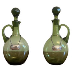 Fine quality pair of antique Victorian green glass spirit decanters
