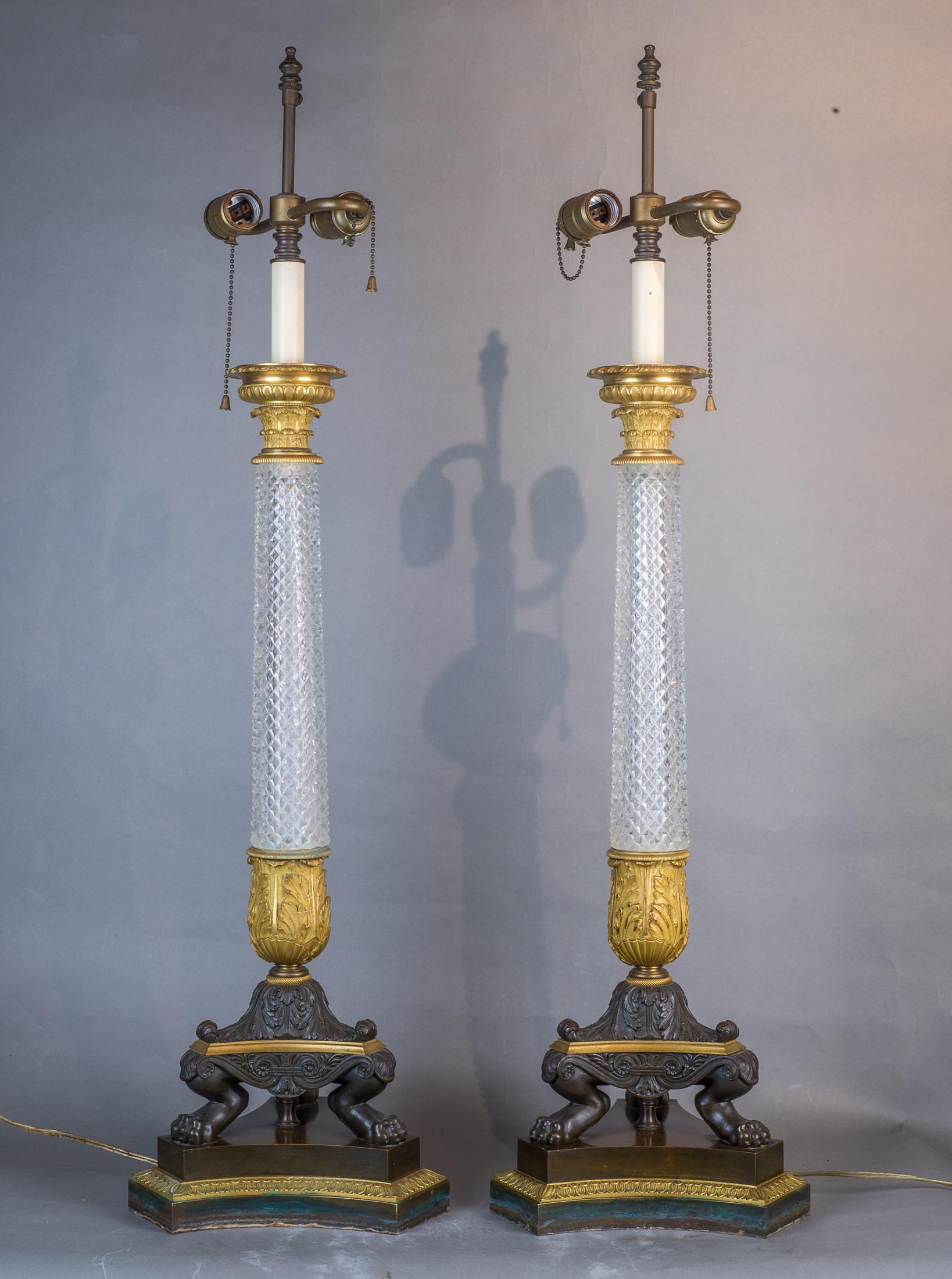 The fine diamond cut crystal column-form table lamps supported by gilt bronze paw feet.

Date: Early 19th century
Origin: French
Dimension: 36 in x 10 in.