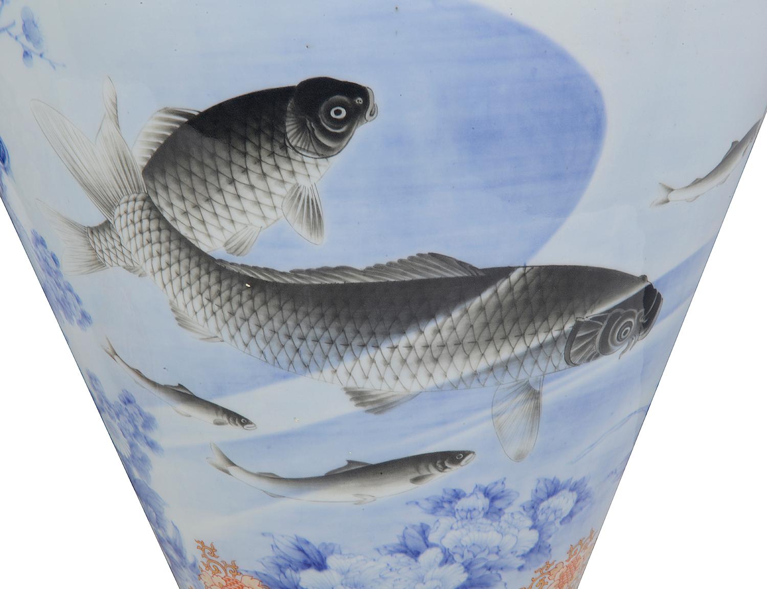 A wonderful fine quality pair of Meiji period (1868-1912) porcelain hand painted Fukagawa Imari vases, 
Each with classical motif decoration to the neck and bases, with scrolling foliate and floral patterns. the central scenes depicting flying