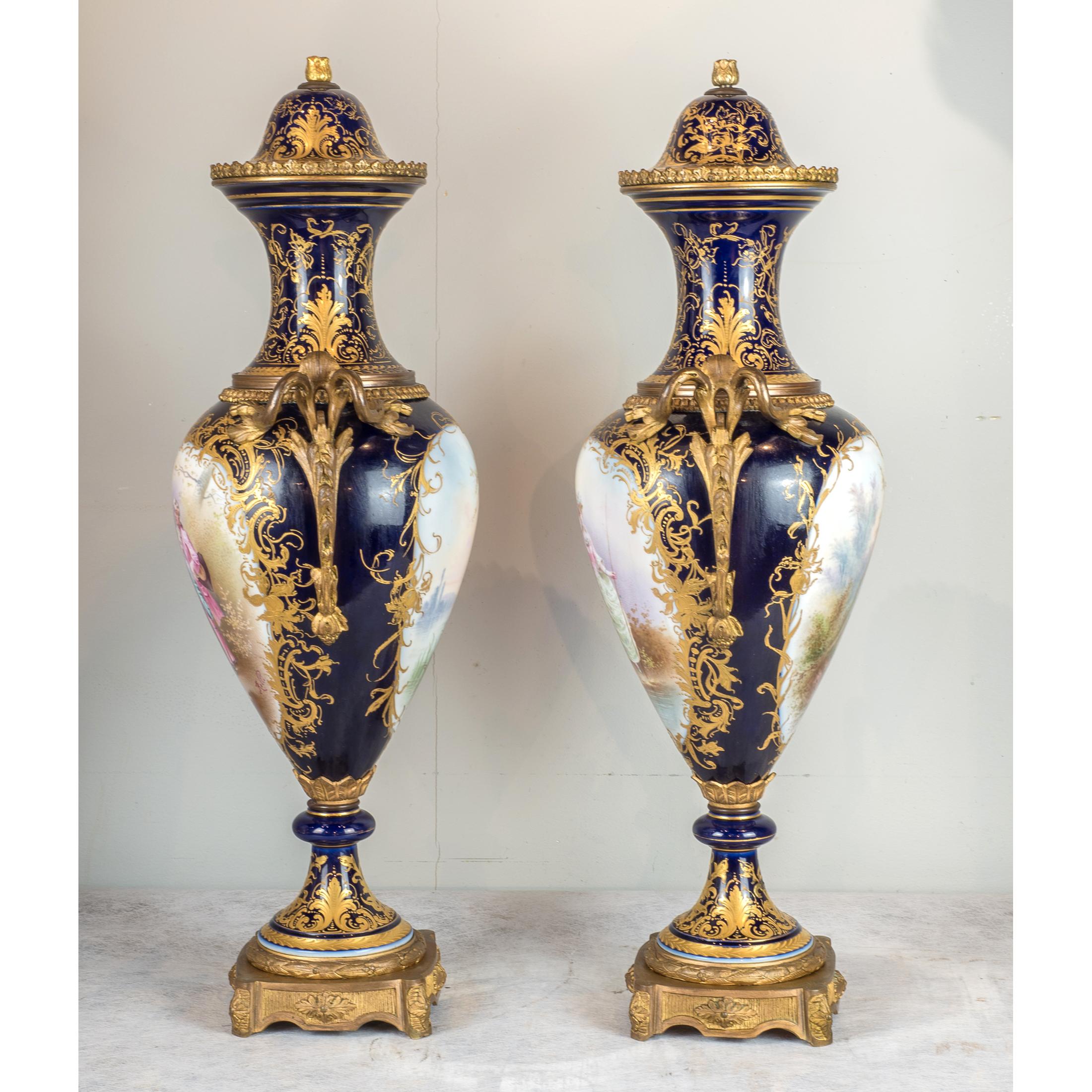 A fine pair of large gilt bronze mounted Sèvres Porcelain vases and cover.
The vases hand-painted with scenes of lovers in the garden, the reverse with landscapes, beautifully gilded throughout on lustre-ground.
Signed ‘Rolli’

Date: 19th