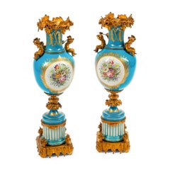 Fine Quality Pair of Sèvres Style Ormolu-Mounted Porcelain Urns with Cherubs