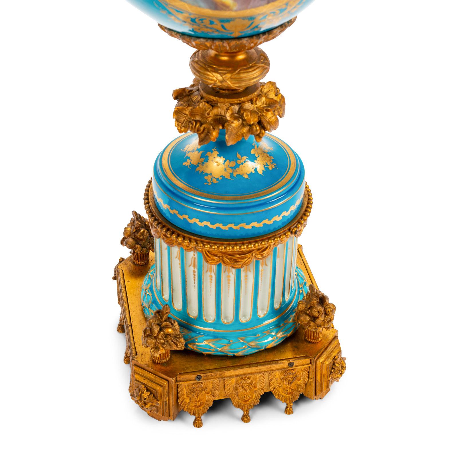 Fine Quality Pair of Sèvres Style Ormolu-Mounted Porcelain Urns with Cherubs In Good Condition For Sale In New York, NY