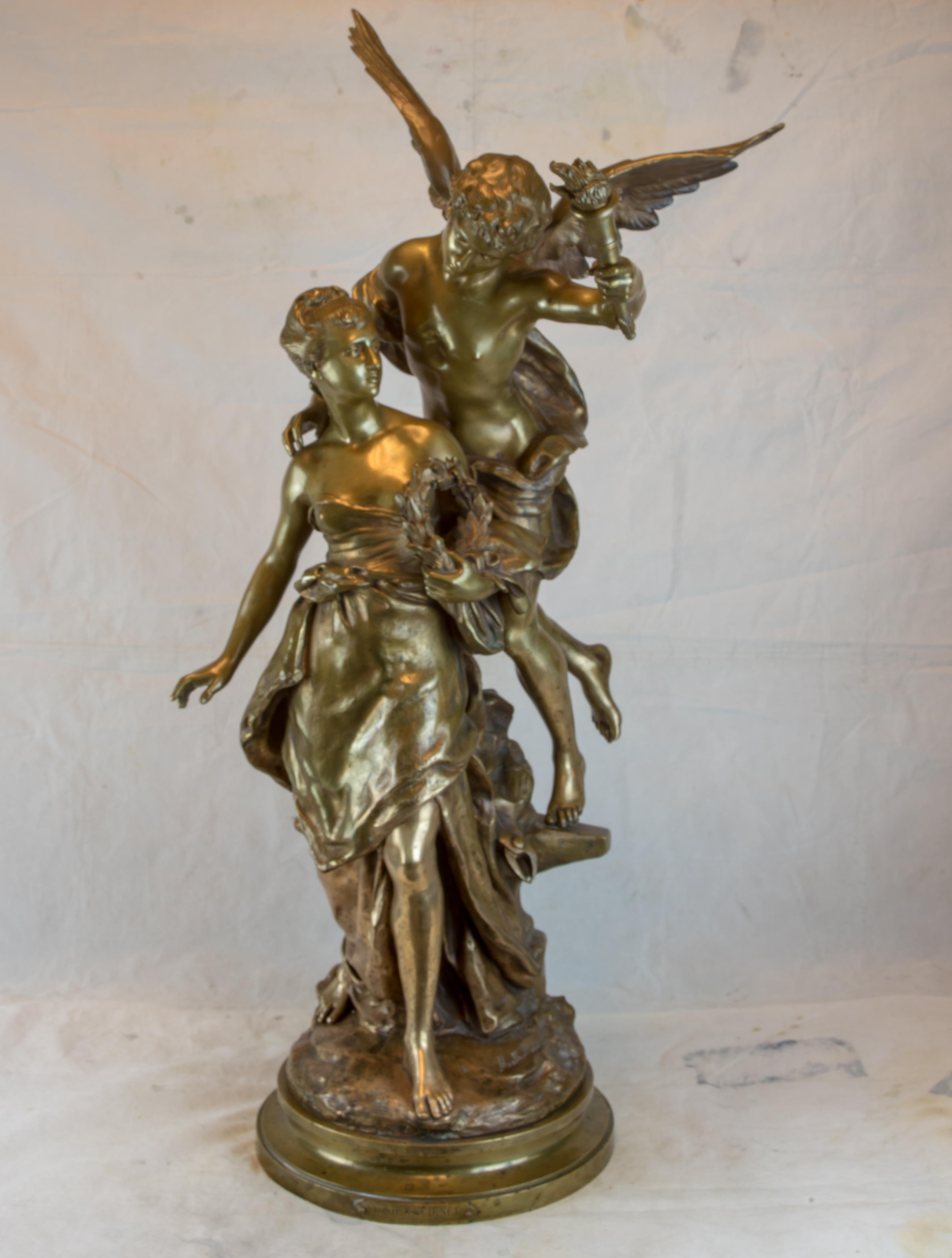 Bronze figural grouping of a Génie and Science, a woman guided by an angel with outstretched wings by Mathurin Moreau, a celebrated and decorated French sculptor whose talents most fruitefully lie in the presentation and rendering of enchanting