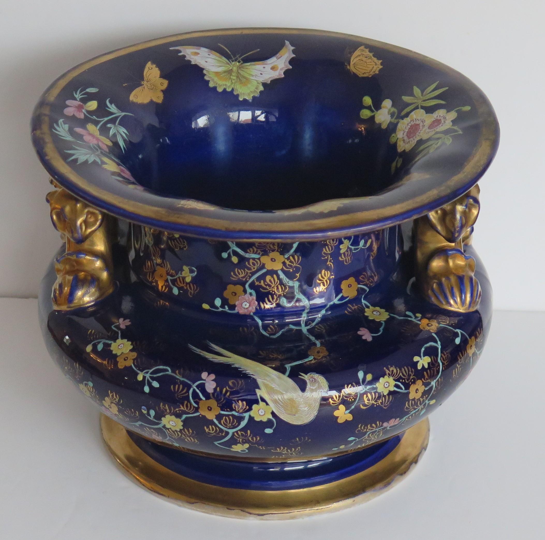 This is a very rare, fine quality ironstone Wine or Fruit Cooler with two side handles, all beautifully hand painted, made by Mason's, of Lane Delph, Staffordshire, England, circa 1815-1820. 

This piece is substantial and heavily potted, weighing