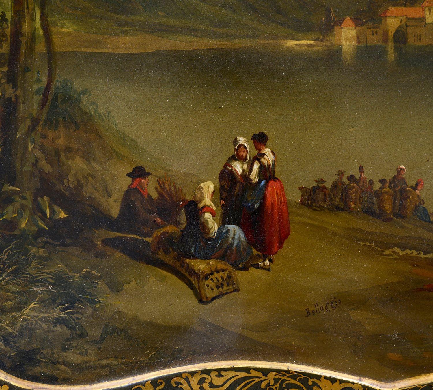 A fine quality early 19th Century Paper Macha tray with scrolling gilded decoration to the boarder, having this wonderful hand painted lake and mountain scene, with people by the shoreline, signed 'Bellaggie'
Stamped to the reverse; Jennens &