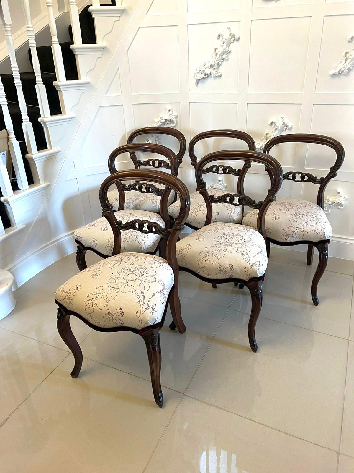 Fine quality set of 6 antique Victorian mahogany dining chairs having a quality mahogany balloon back with carved scrolls shaped carved pierced splat to the centre, newly reupholstered serpentine shaped seats in a beautiful quality fabric standing