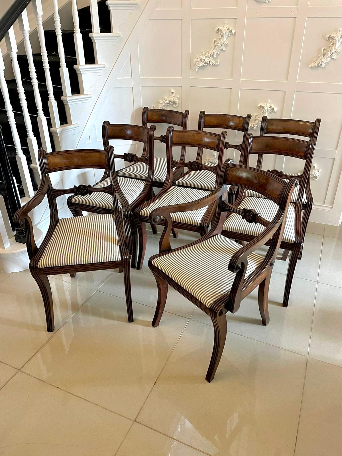 Fine quality set of 8 antique Regency mahogany dining chairs consisting of 2 carver chairs and 6 single chairs having a fine quality figured mahogany top rail with a reeded edge. The carver chairs have shaped scrolled open reeded arm, carved splat