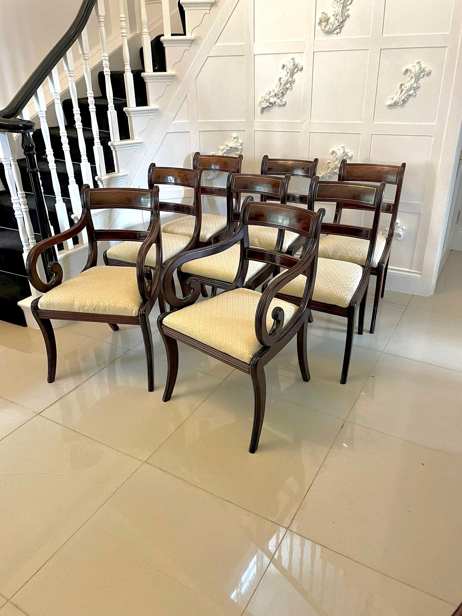 Fine quality set of 8 regency mahogany brass inlaid dining chairs consisting of a pair of elbow chairs and 6 single chairs having fine quality figured mahogany backs with original brass inlay, the elbow chairs having shaped scroll reeded open arms,