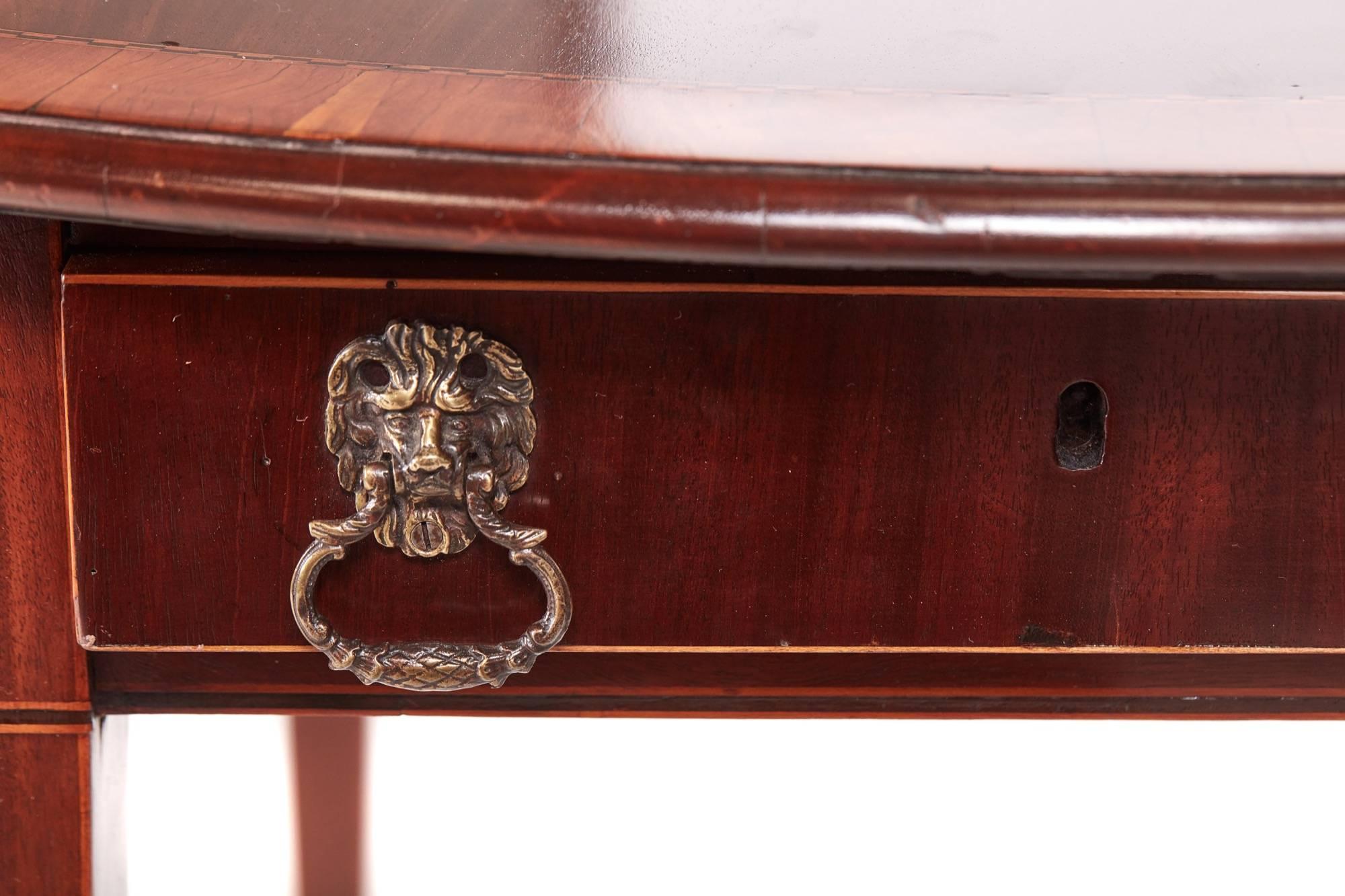 Fine quality sheraton period inlaid mahogany pembroke table,having a quality mahogany top crossbanded in satinwood,two oval drop leaves,one drawer and one dummy drawer to the frieze with original brass handles, standing on four square tapering legs