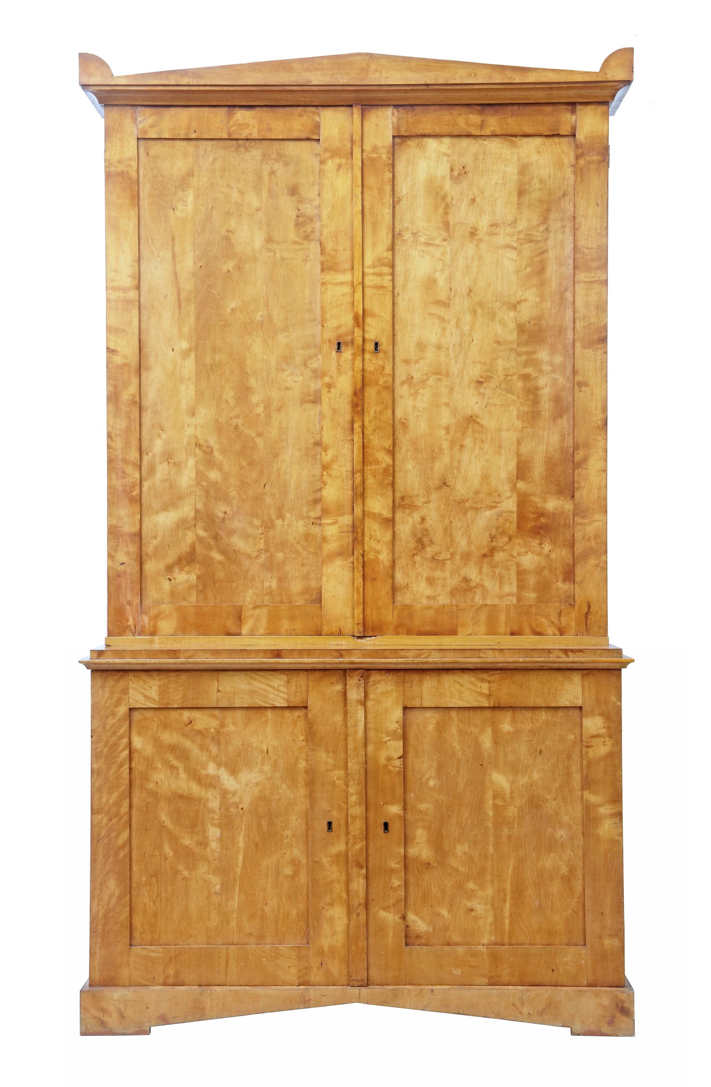 Fine quality Swedish 19th century birch cabinet circa 1870.

Good quality architectural birch cabinet from the mid-19th century. Cabinet comprises of 2 parts with rich quarter sawn veneers used. Shaped cornice with a double door cabinet below