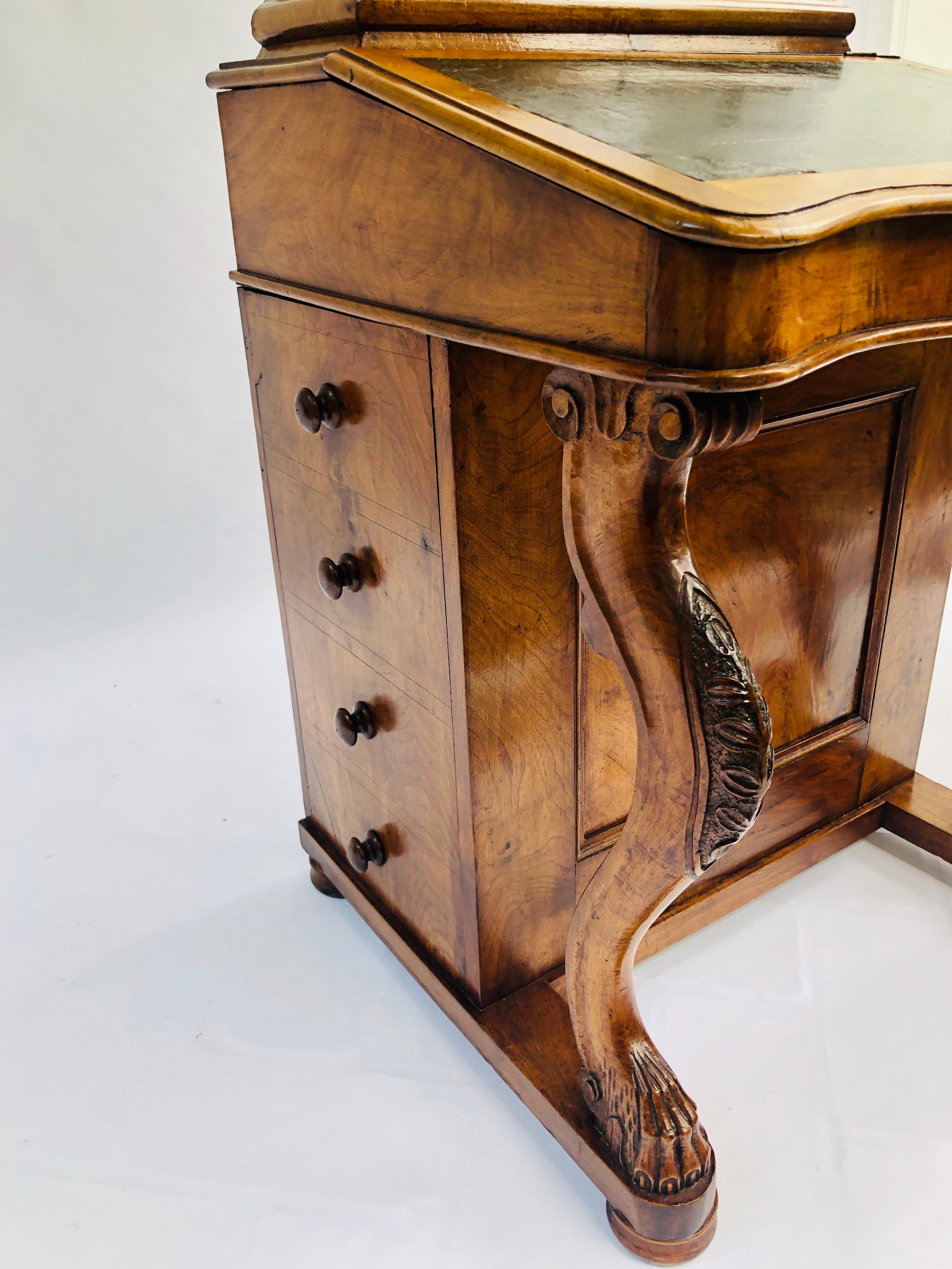 Fine quality Victorian burr walnut davenport desk having the original brass gallery which lifts up to reveal a lovely original condition stationary store. A serpentine shaped writing slope with original dark green leather. It has 4 opening drawers