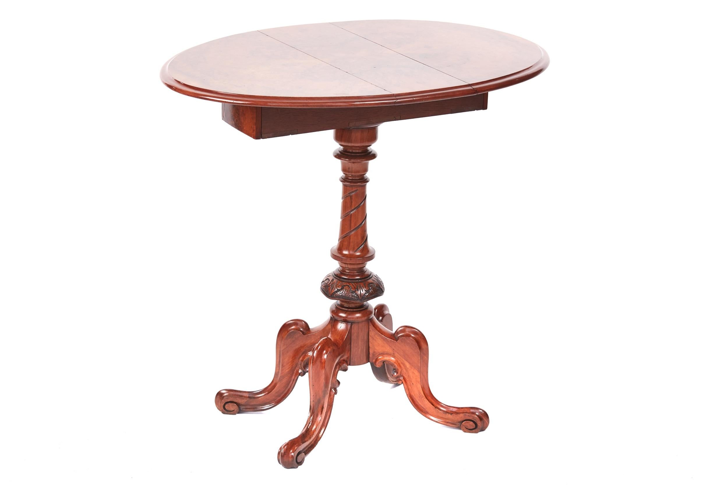 Fine quality Victorian burr walnut drop leaf lamp table, having a fine quality burr walnut top with a thumb moulded edge, two drop leaves, top spin around to form a oval top, two frieze drawers, supported by a shaped turned and carved column,