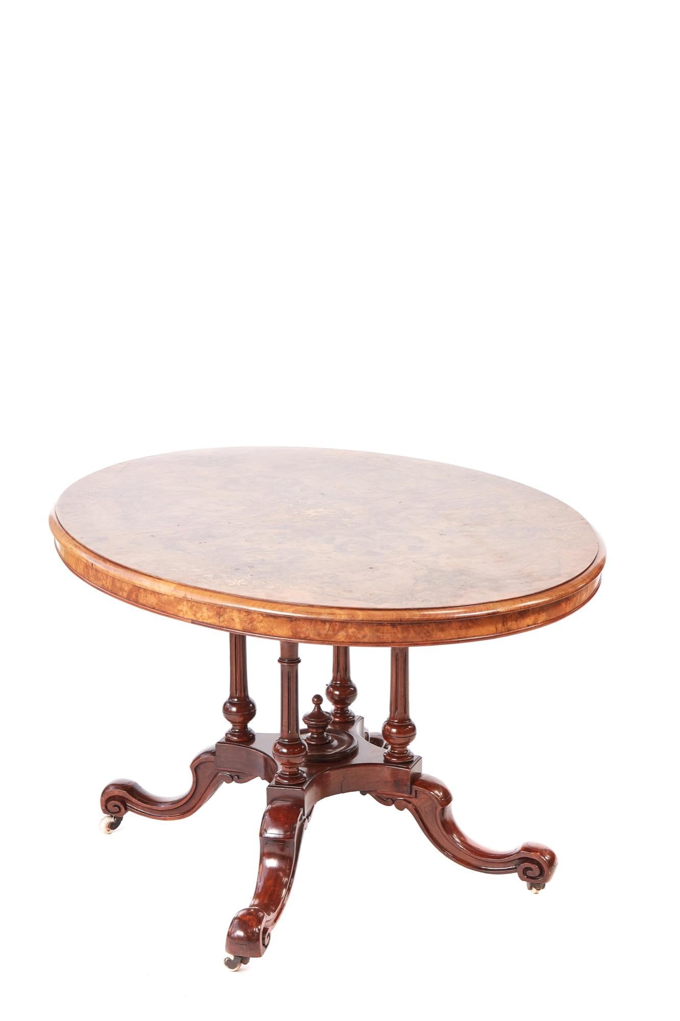 Fine quality victorian oval burr walnut inlaid centre table,having a oval burr walnut top inlaid with satinwood and a thumb moulded edge supported by a quality solid walnut base consisting of four reeded columns,standing on four shaped cabriole legs