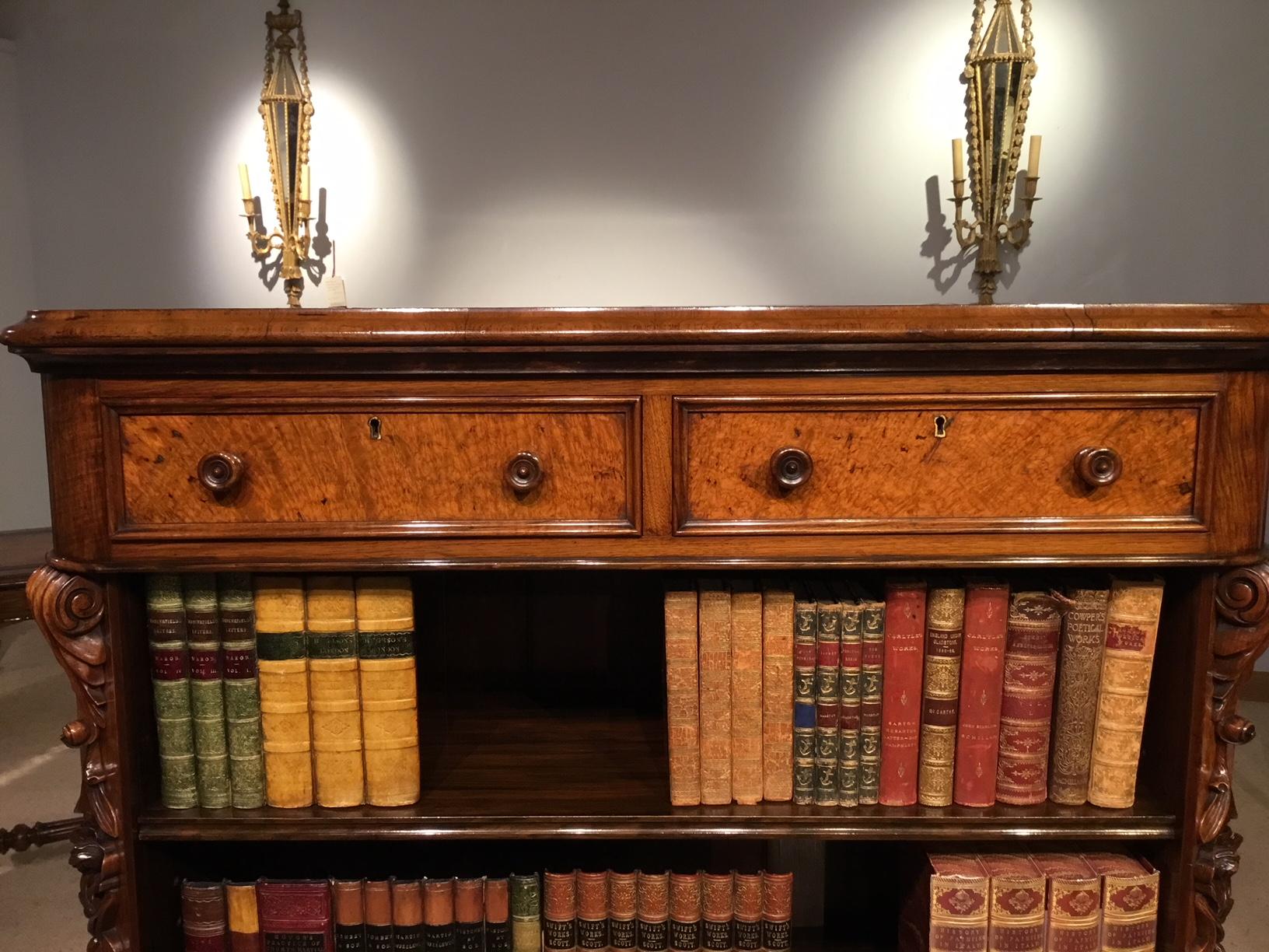 A fine quality Victorian period burr walnut open bookcase. The top is veneered in the finest well figured burr walnut with rounded corners and an ogee moulded edge. With two rectangular cedar lined frieze drawers veneered in burr walnut and having