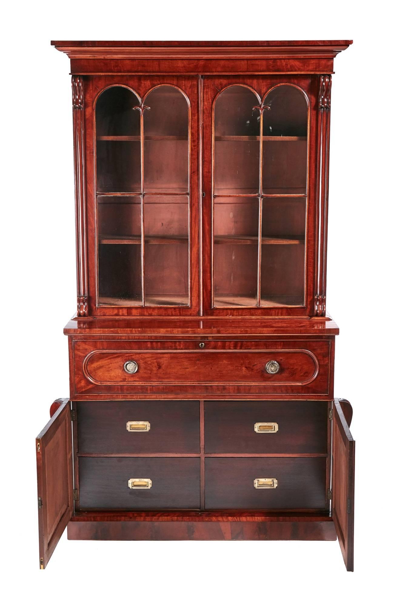 Fine quality William IV mahogany secretaire bookcase, with a shaped cornice, two lovely carved glazed doors, three adjustable shelves, the secretaire drawer opens to reveal a fitted interior and a leather writing surface, below two-carved mahogany