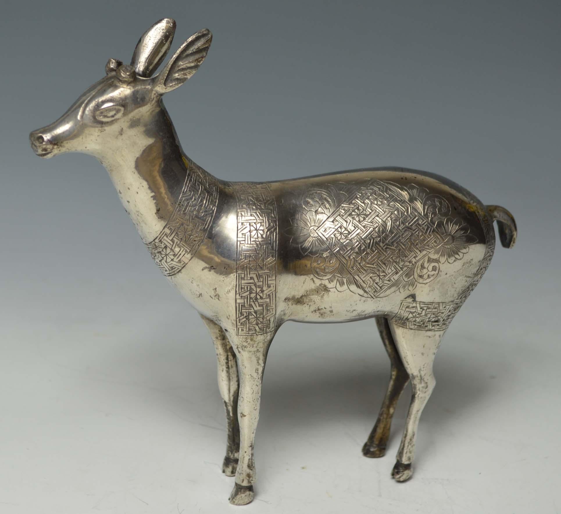 Fine rare Persian Qajar silver deer figure Islamic art
A finely made silver model of a deer with engraved designs in high grade silver
Period: Persian 19th century 
Size height 16 cm 6 inches, length 18 cm, 7 inches , weight 360 grams
condition :