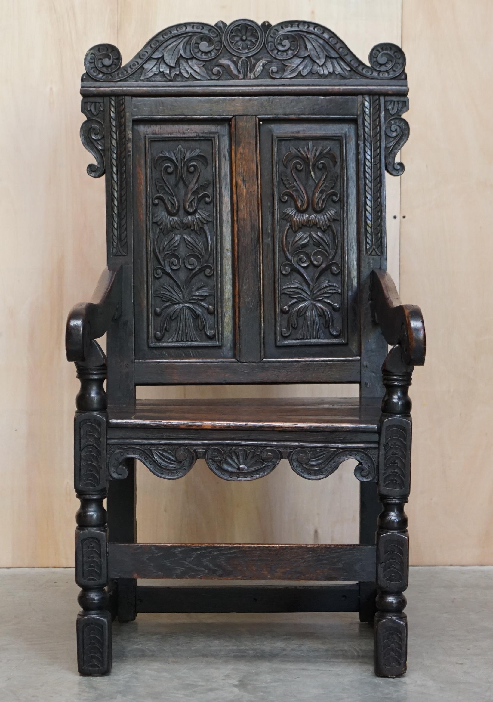 We are delighted to offer for sale this rare original 18th century Northern English hand carved from solid oak Wainscot armchair circa 1720

A highly decorative and original piece with turned finials above a moulded and carved back panel, the down