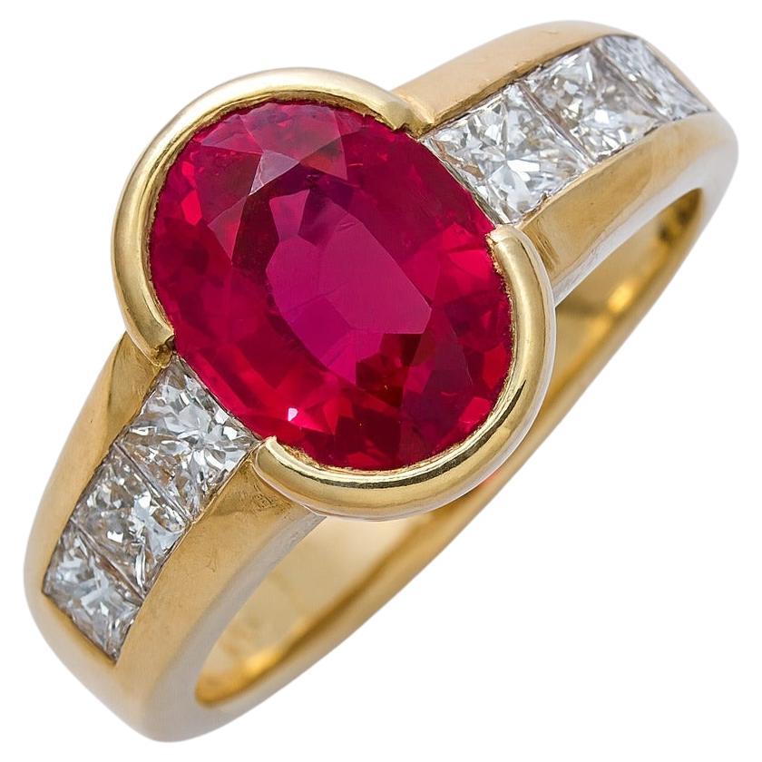 Fine & Rare Vintage 1980s French Burma Ruby and Diamond Ring in 18K Yellow Gold

A striking creation from 1980s France, this fine and rare vintage ring centers on a vivid red natural Burmese ruby of exceptional presence. The oval ruby weighs exactly