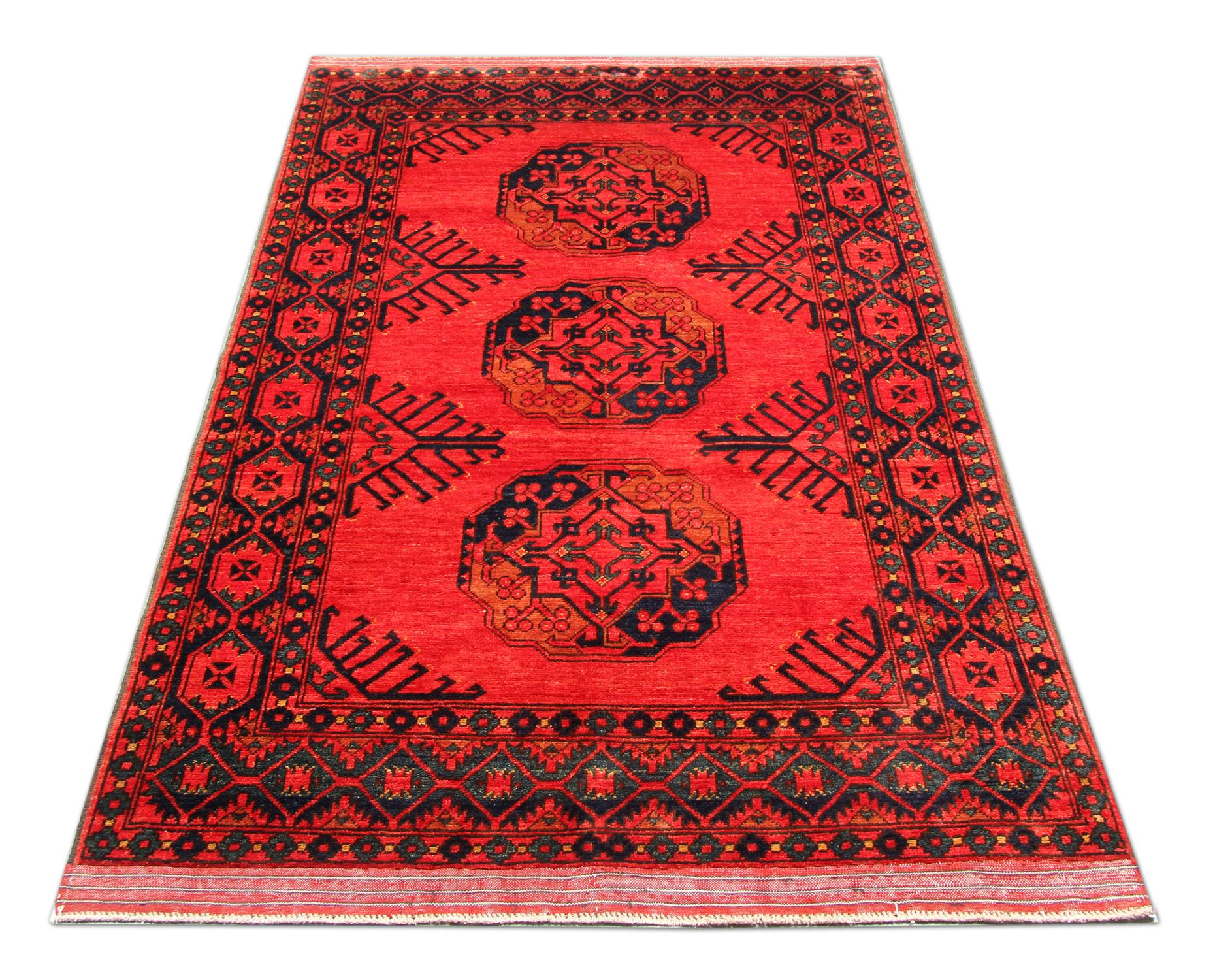 This traditional Turkman rug is one of our more luxurious rugs made on looms by master weavers of Afghan rugs. This cream rug is made with or all handspun wool, with the color coming from organic vegetable dyes. This carpet features a tribal