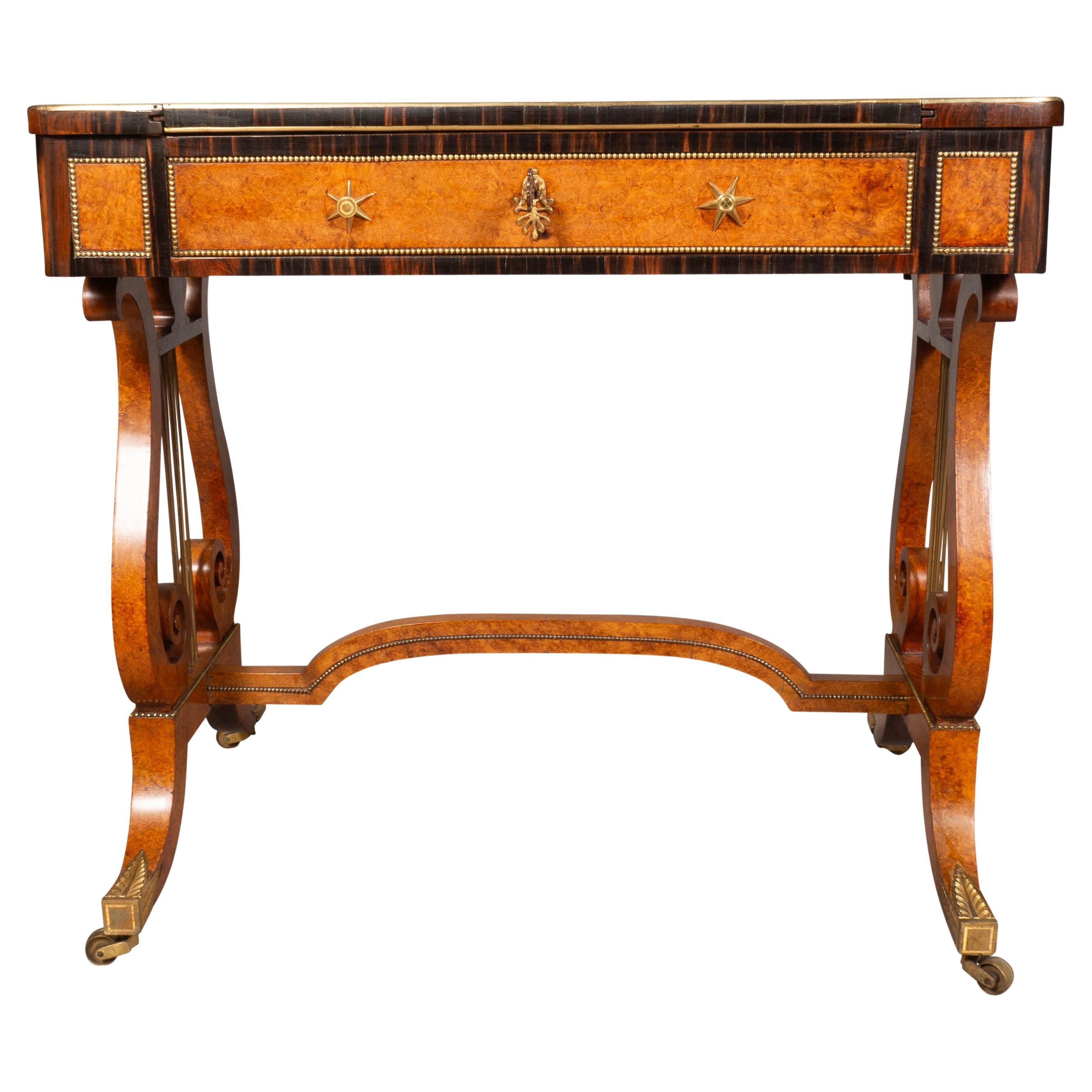 Fine quality with rectangular top with brass edge and reversible top exposing a chessboard. With panel removed you have a leather backgammon playing surface. Raised on Lyre form trestle base with stretcher. False drawers with star handles.Saber legs