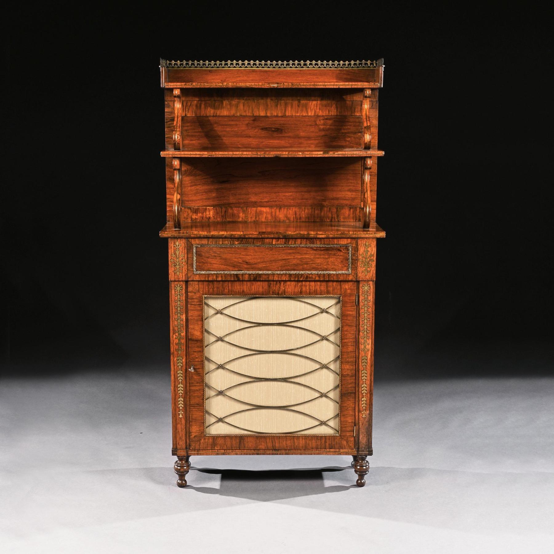 A fine quality Regency antique rosewood and brass inlaid chiffonier of diminutive proportions with waterfall superstructure.

English, circa 1810-1815.

This fine quality Regency chiffonier decorated with brass inlay has a two tier upstand