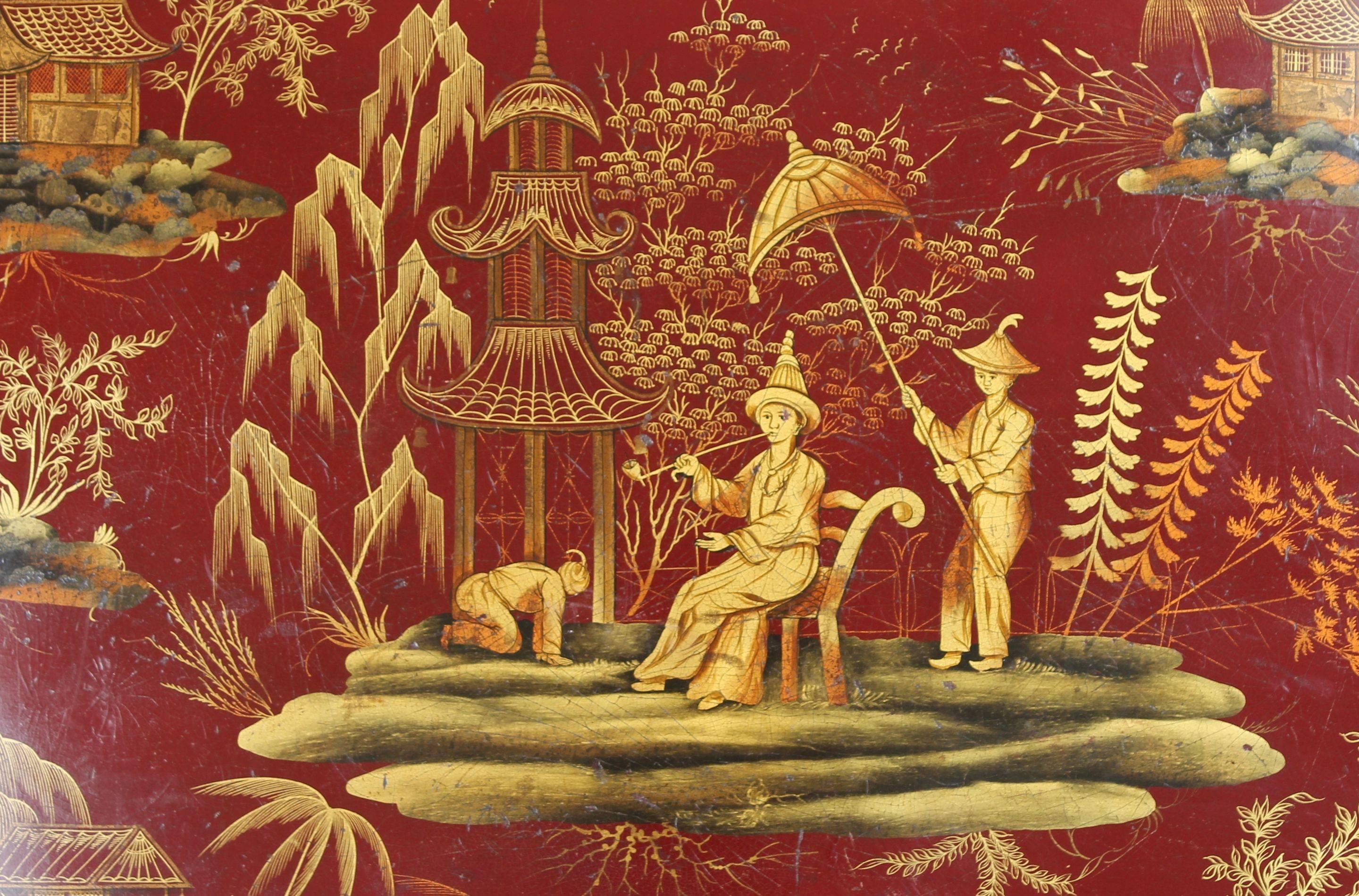 Fine Regency papier mâché tray decorated with gilded 'chinoiseries' on a maroon ground.

Stand available.