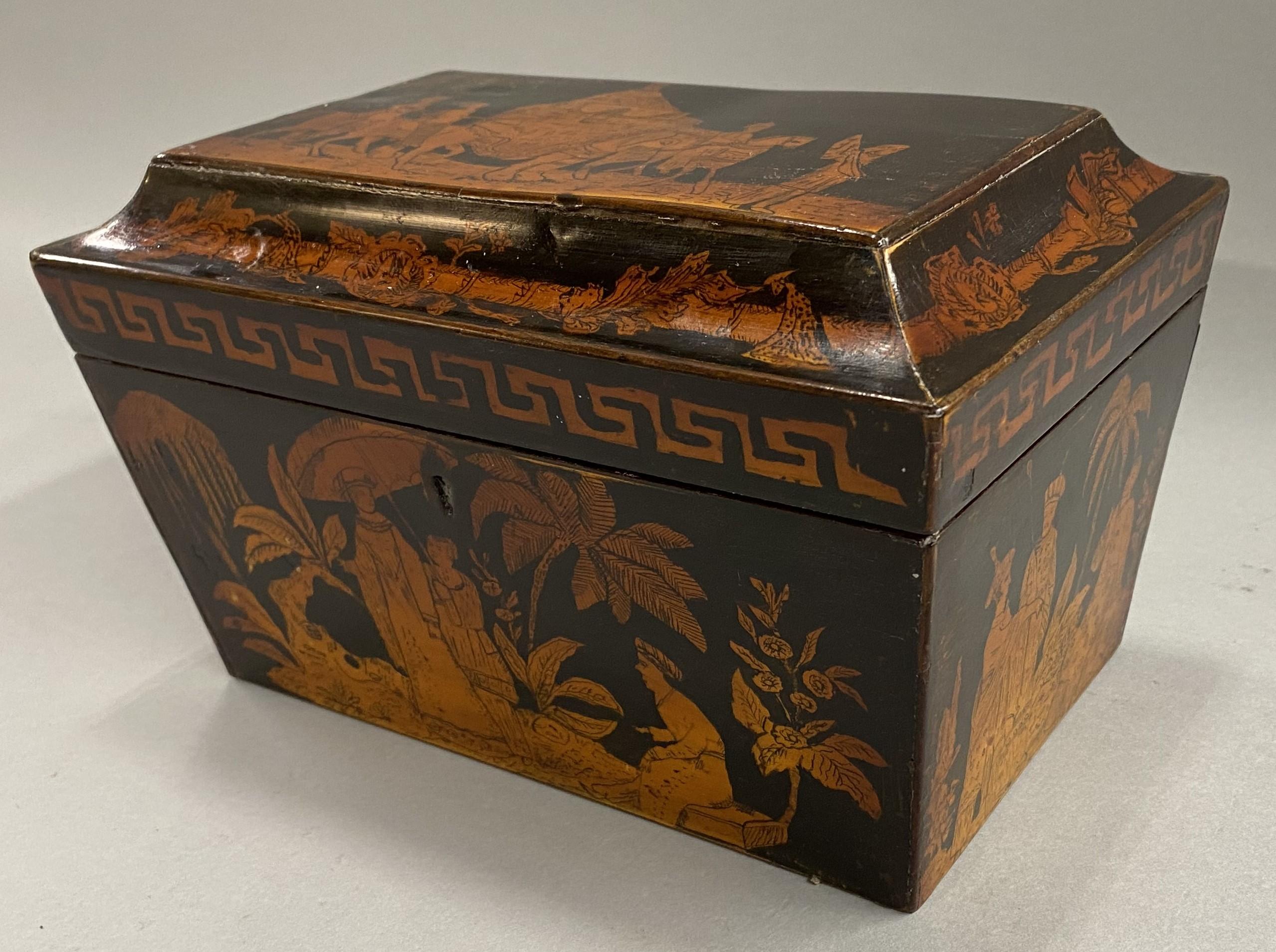 A fine Regency penwork rectangular tea caddy in the Chinoiserie taste with lacquered surface, foliate and figural decoration on all sides, including the interior, with an elephant handler on the hinged lid. The two interior tea compartments are foil
