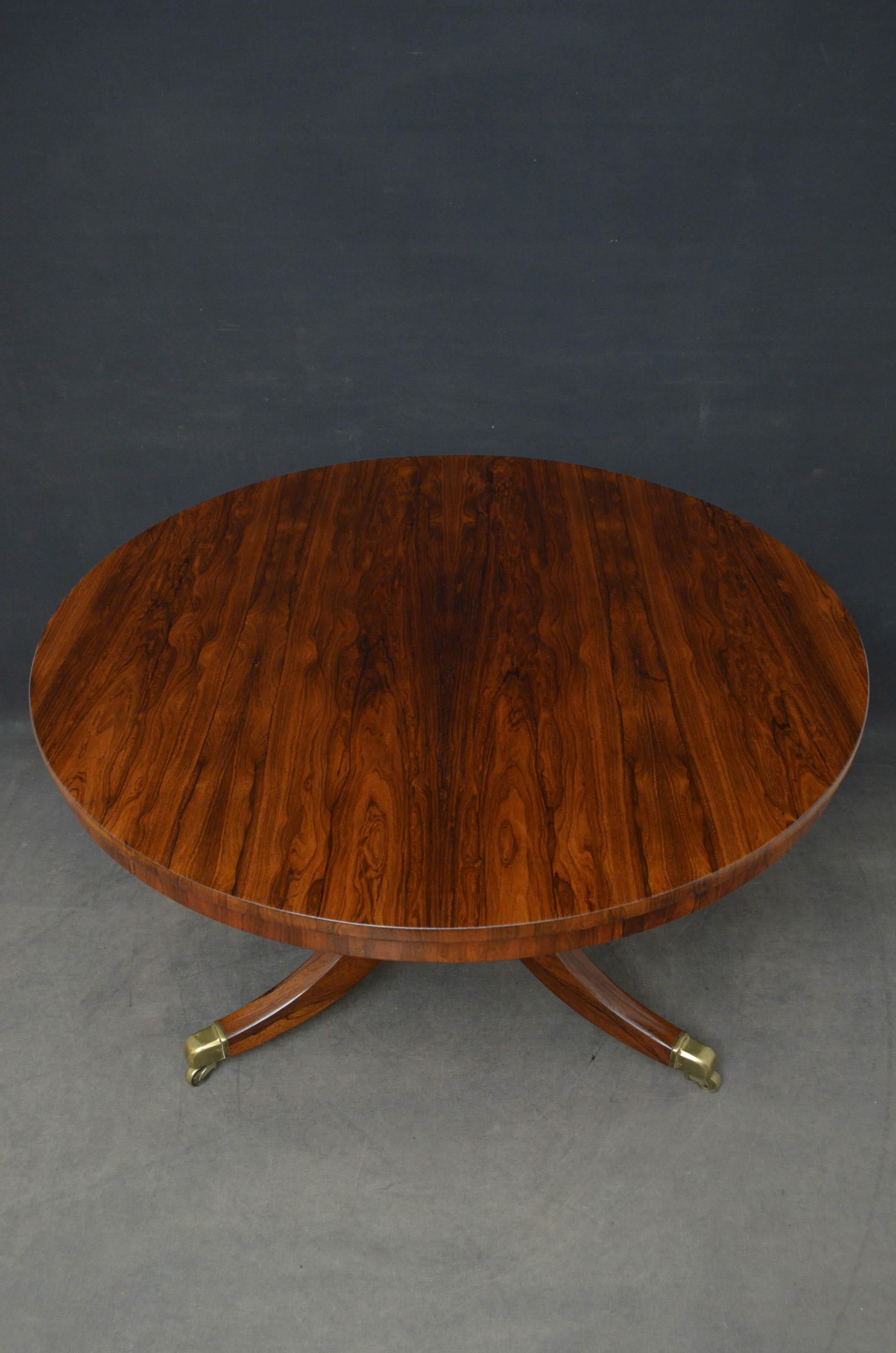 Sn4689 fine quality Regency tilt top dining table in rosewood, having stunning top on turned column terminating in 3 downswept legs and original brass castors.
This antique table has been sympathetically restored and is ready to place at home,