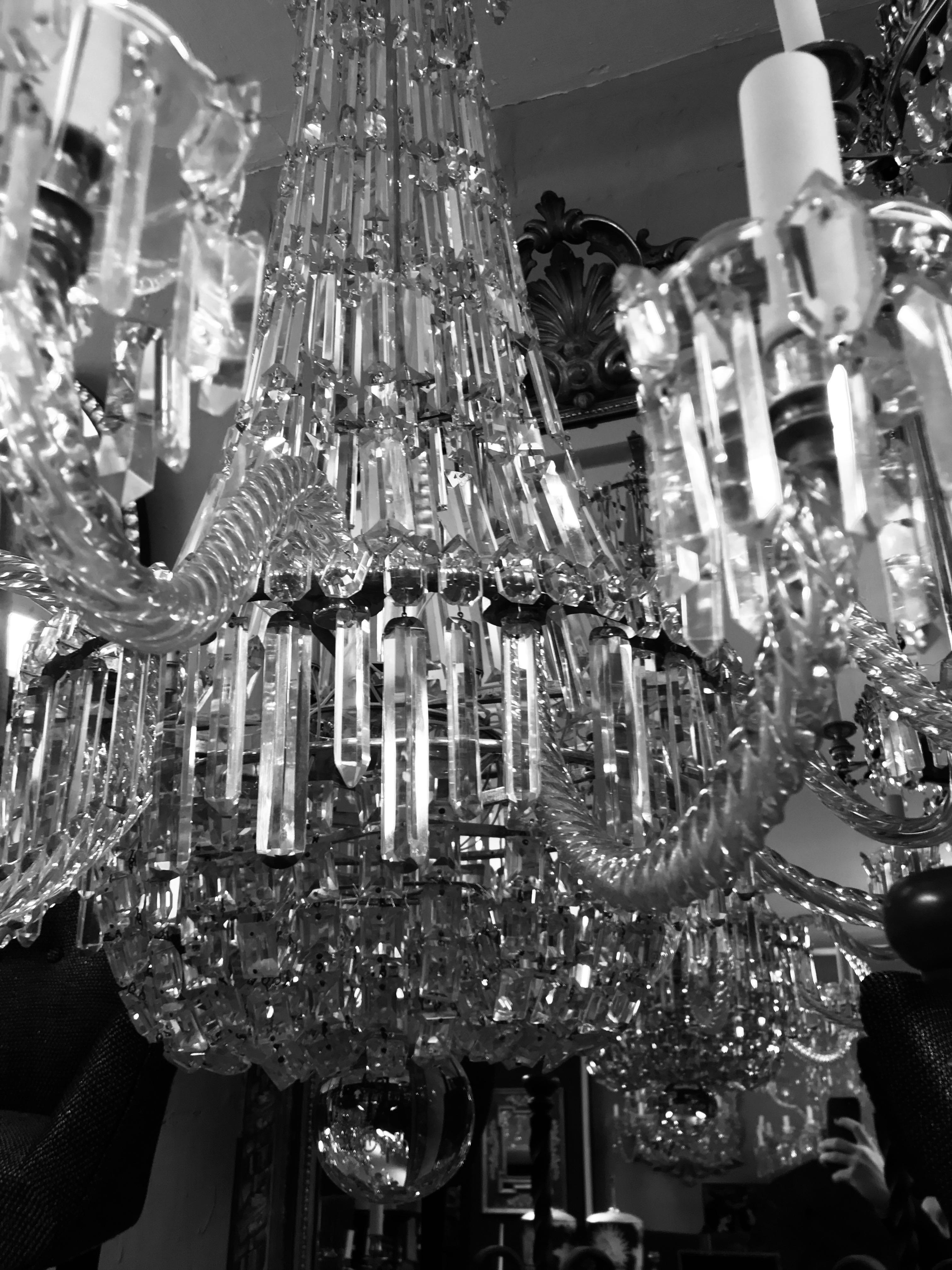 A fine English Regency tent and waterfall chandelier of large proportions. Comprising twelve arms and hung throughout with good cut-glass.

  