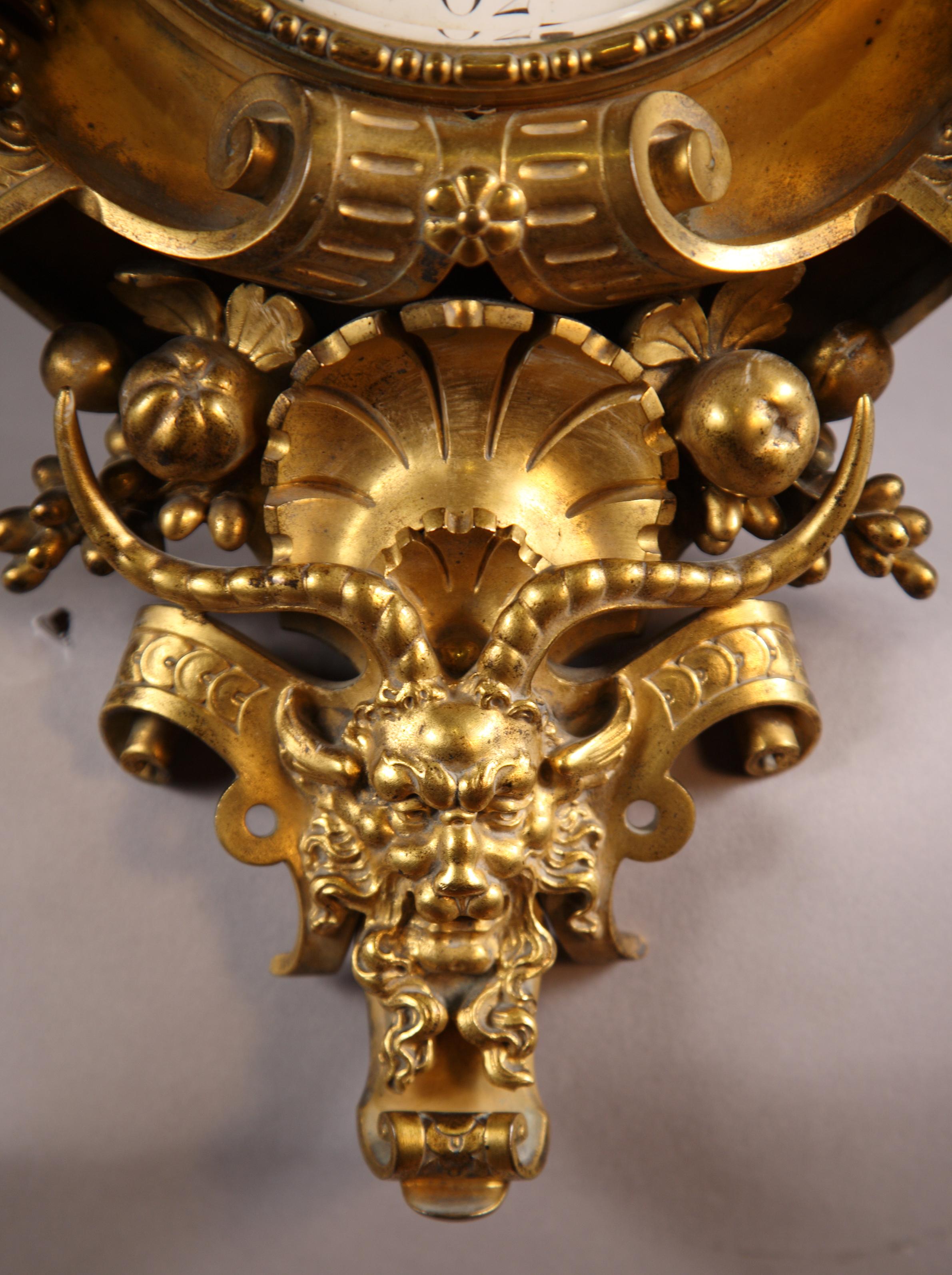 Signed on the dial F. Barbedienne à Paris

A gilt bronze wall-clock decorated with Renaissance style motifs, such as scalloped scrolls, pomegranates, a faun head and putti framing the dial.

In decorative arts, the 