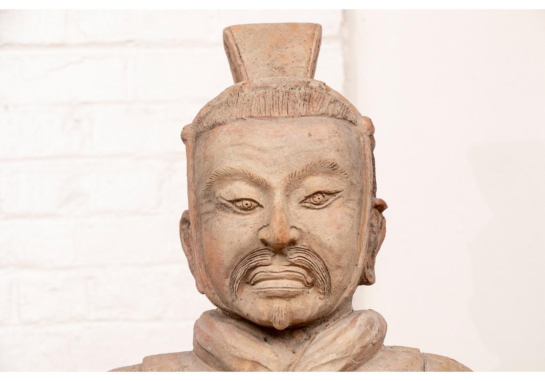 Finely made replica of an ancient Chinese painted terracotta warrior figure, the original over 2000 years old, and one of many made to guard the emperor's tomb of Qin Shi Huang. This handsome figure is dressed in a textured breastplate and would