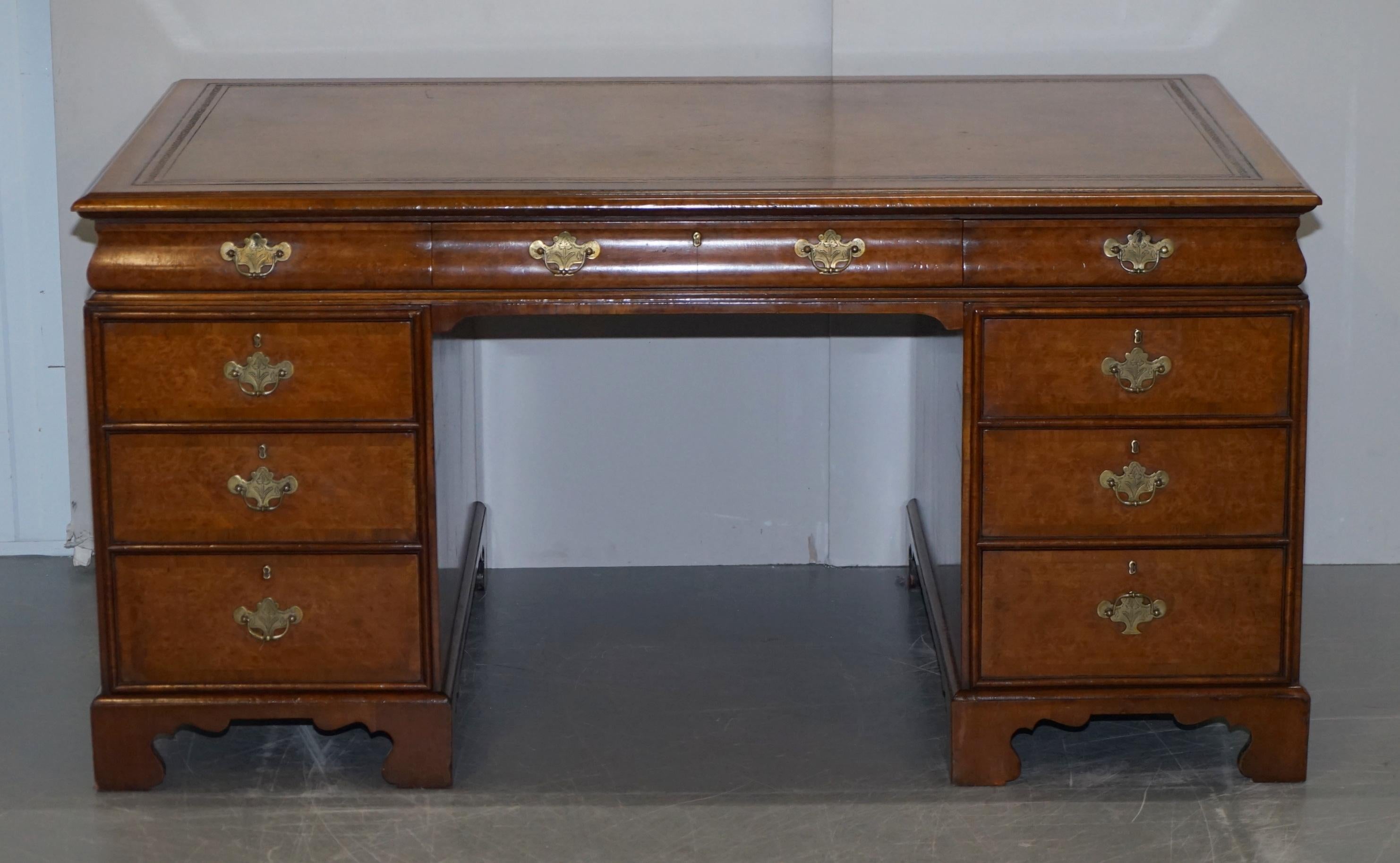 We are delighted to offer for sale this very fine fully restored Hamptons of Kensington Burr Walnut twin pedestal partner desk with hand dyed brown leather top

What a desk….. these cushion curved drawer desks almost never come up for sale, they