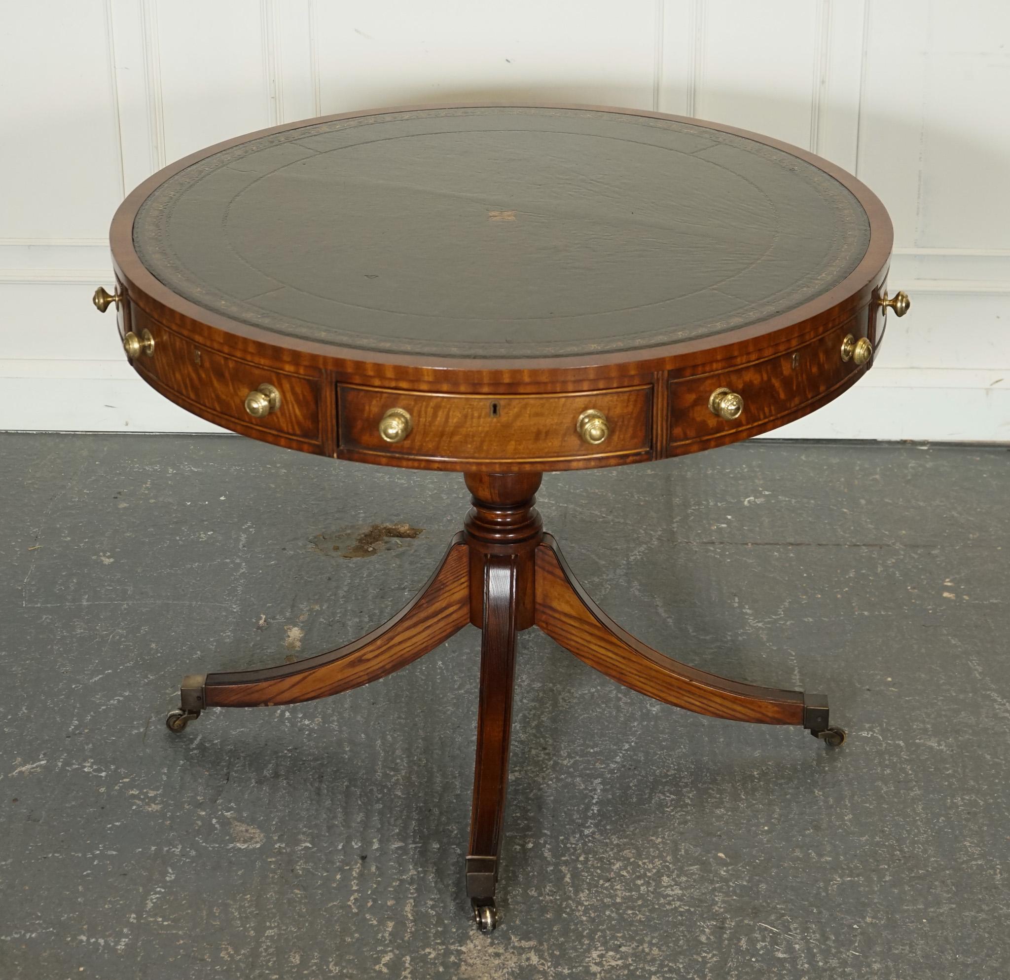 
We are delighted to offer for sale this Fine Restored Regency Drum Top Library Table.

 It is a timeless piece that beautifully combines elegance with functionality. This exquisite table features a stunning aged green leather top, meticulously
